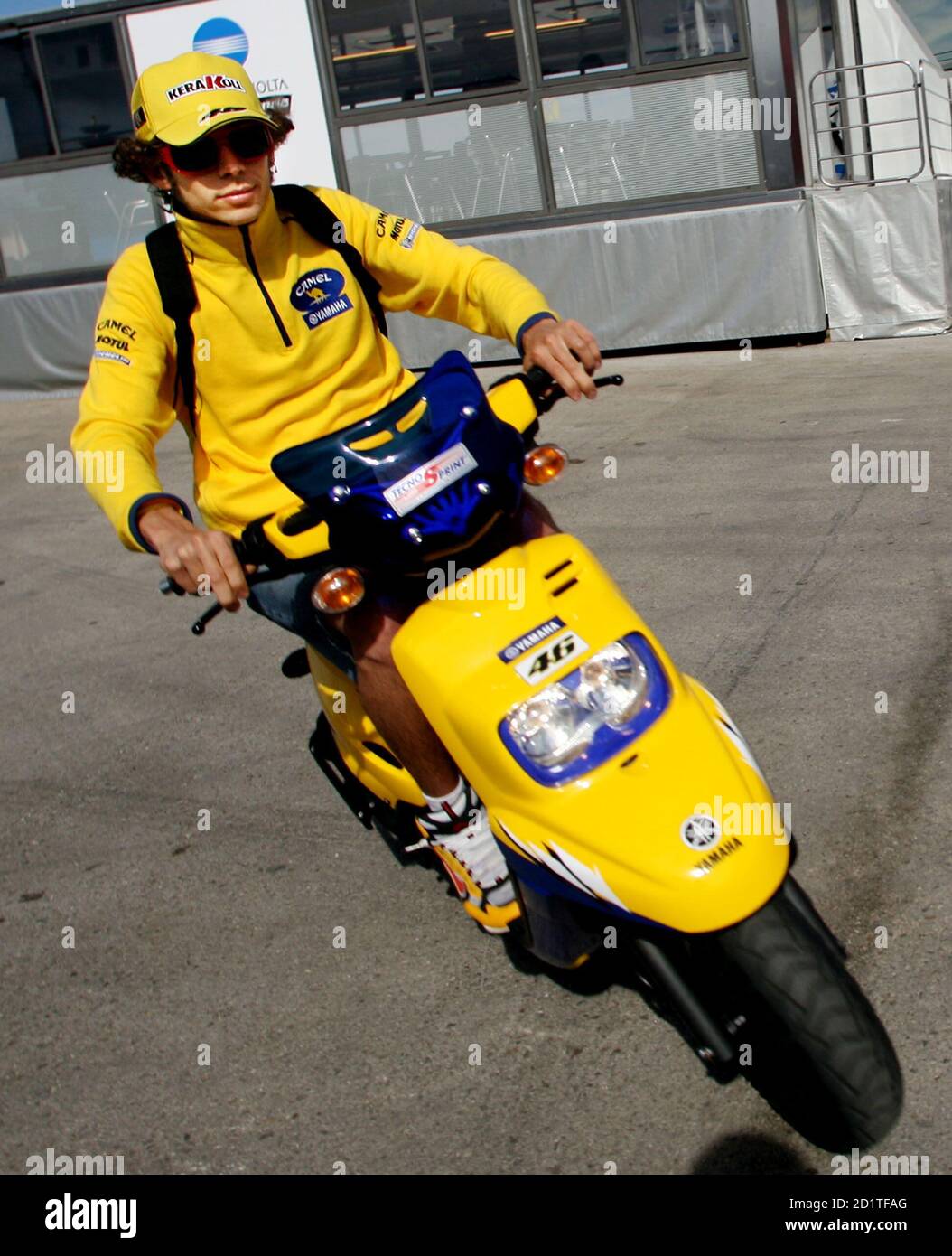 MotoGP rider Valentino Rossi of Italy rides a scooter before a training  session at the Jerez racetrack in Jerez, southern Spain, March 12, 2006.  The new MotoGP season kicks off in Jerez
