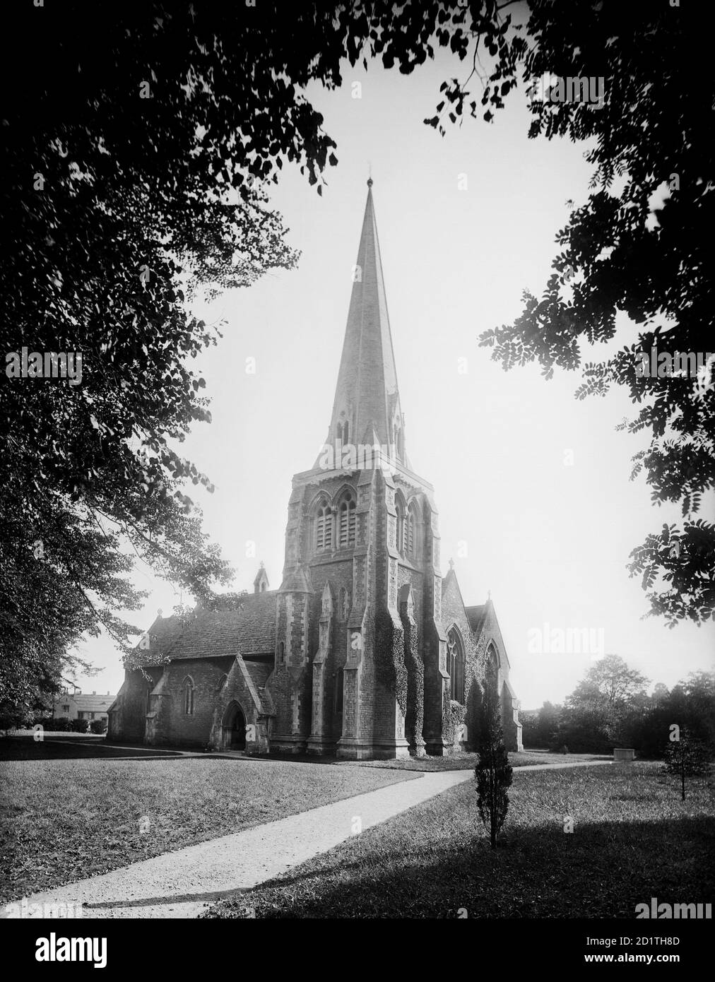 HOLY TRINITY CHURCH, Cirencester, Gloucestershire. The church exterior from the north-west. Made from Forest Marble and with a stone roof, it was designed by Sir George Gilbert Scott and built in 1850-1. Photographed in 1890 by Henry Taunt. Stock Photo