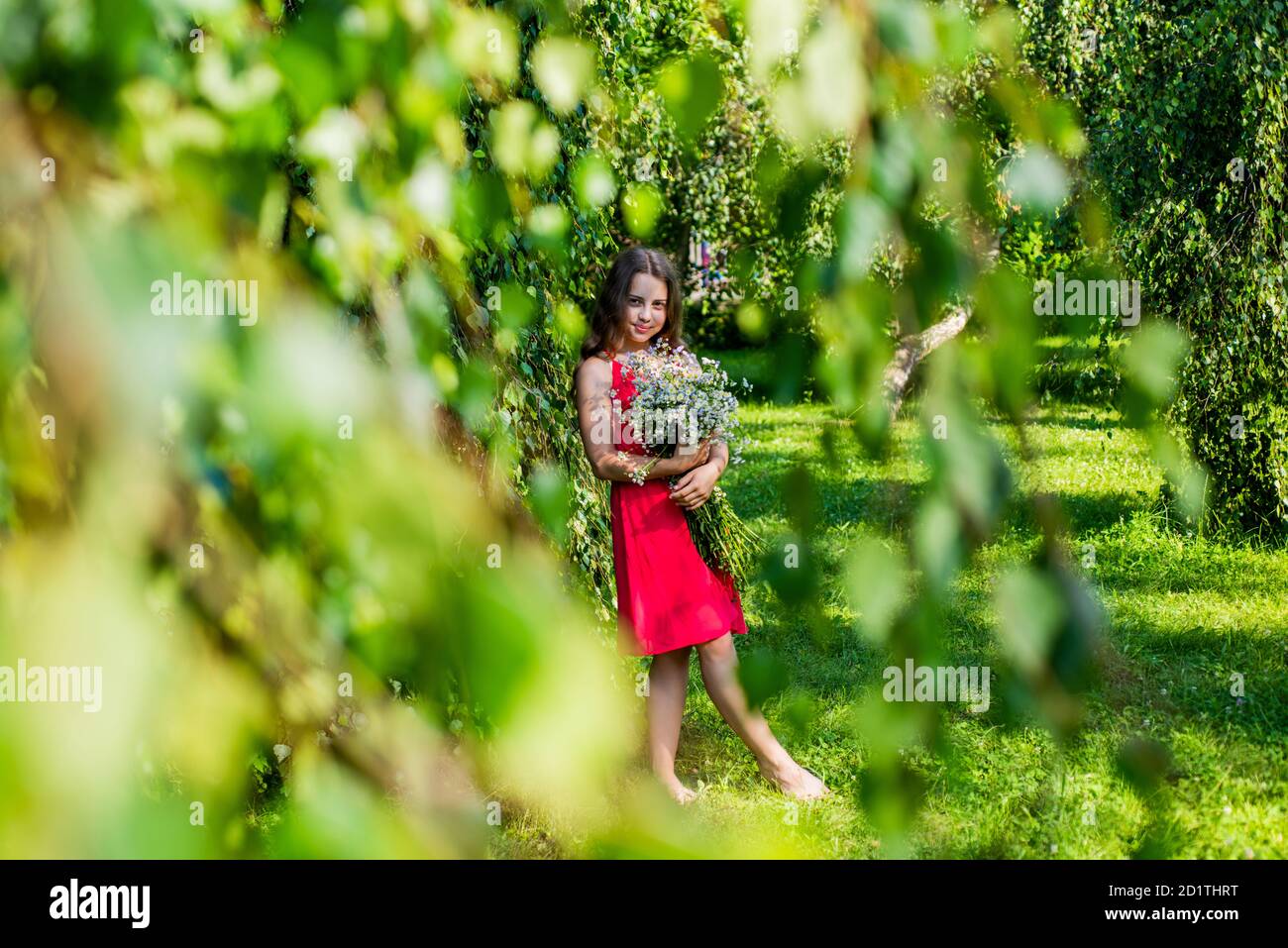 Natural spa. Little girl hold flowers in garden. Summer fashion style.  Beauty and spa. Health and recreation. Hair salon. Skincare and haircare  Stock Photo - Alamy