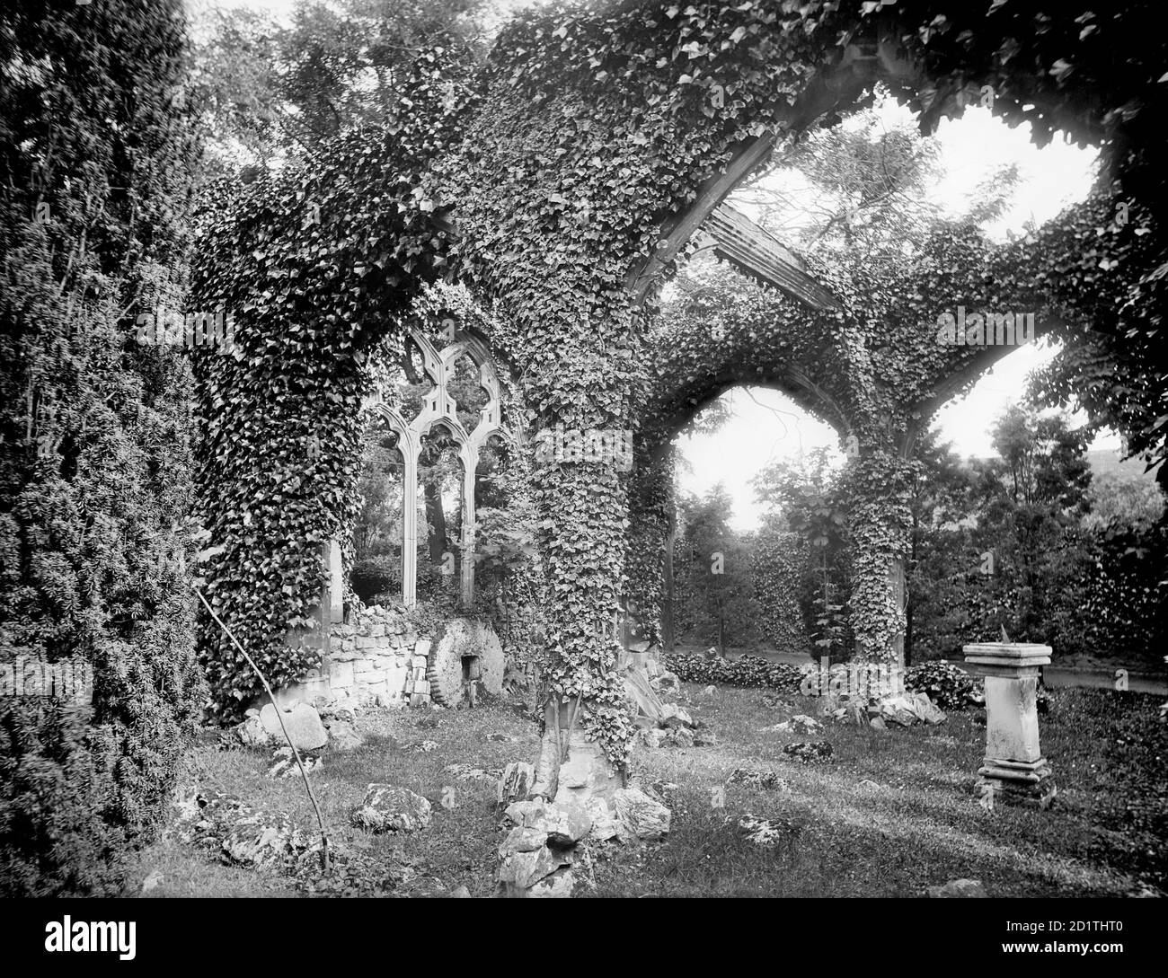 ABINGDON, Oxfordshire. Overgrown arcades and windows of the sham abbey ruin in the gardens of Abingdon Abbey. Photographed in 1892 by Henry W Taunt. Stock Photo
