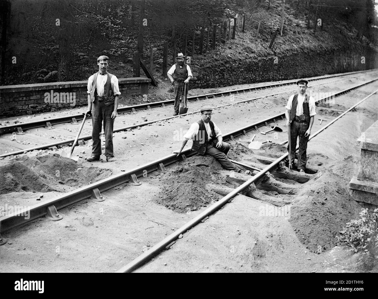 BODMIN ROAD STATION, St Winnow, Cornwall. Four tracklayers at work. In 1888 the Great Western Railway made a branch line from Boscarne Junction to Bodmin Road Station, which is now known as Bodmin Parkway Station. This linked the area to the main railway network. Alfred Newton and Son 1901 Stock Photo