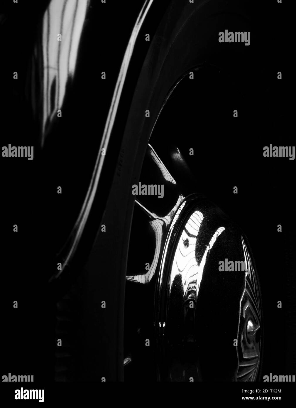 Abstract detail of black car's wheel and wheel arch. Stock Photo