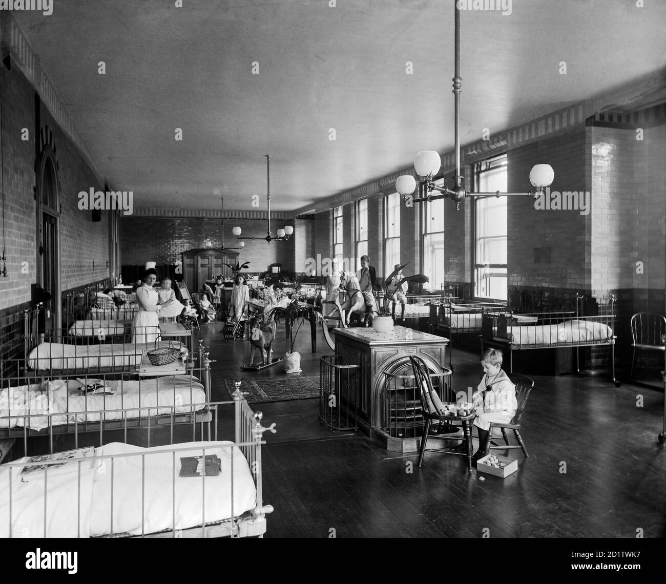 THE HOSPITAL FOR SICK CHILDREN, Great Ormond Street, London. Interior of the Clarence Ward showing nurses and children. The Hospital for Sick Children later became known as Great Ormond Street Hospital. Photographed for the secretary of the hospital by Bedford Lemere and Co. in May 1893. Stock Photo