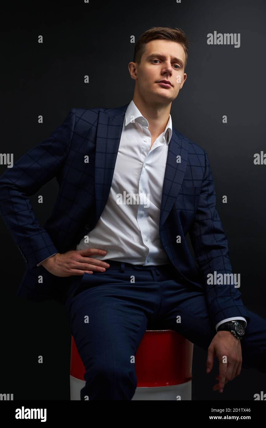 Portrait Of Sublime Rich Well Off Man In Suit Isolated On Black Background Male In Classic Wear Has Own Business Sits On Oil Barrel Success Concept Stock Photo Alamy