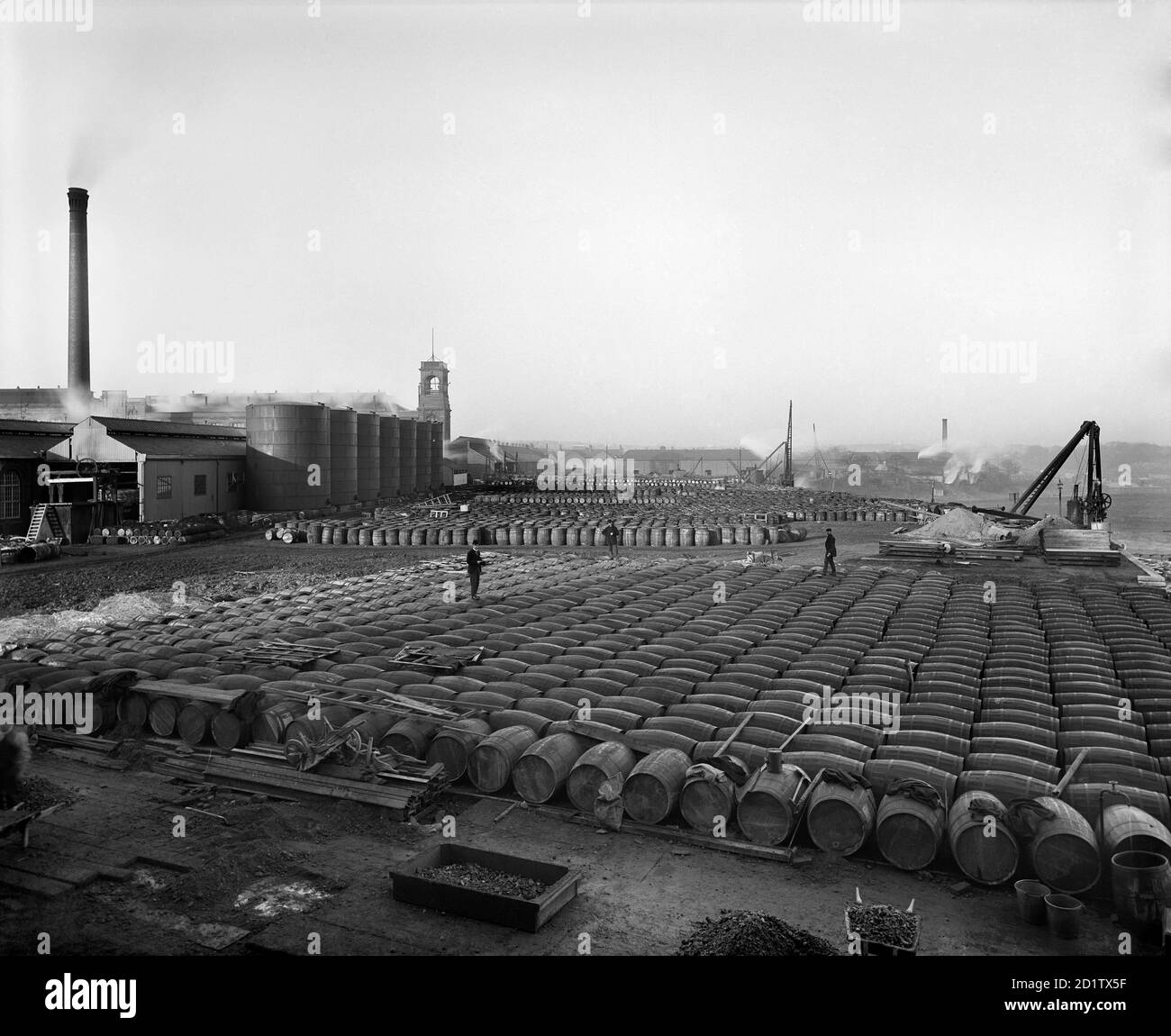 LEVER BROTHERS SUNLIGHT SOAP WORKS, Port Sunlight, Wirral, Merseyside. Photographed by Bedford Lemere & Co. in April 1897. Thousands of barrels of tallow and other soap ingredients stacked in rows, with factory buildings in the background left. This photograph was commissioned by Lever Brothers. Stock Photo