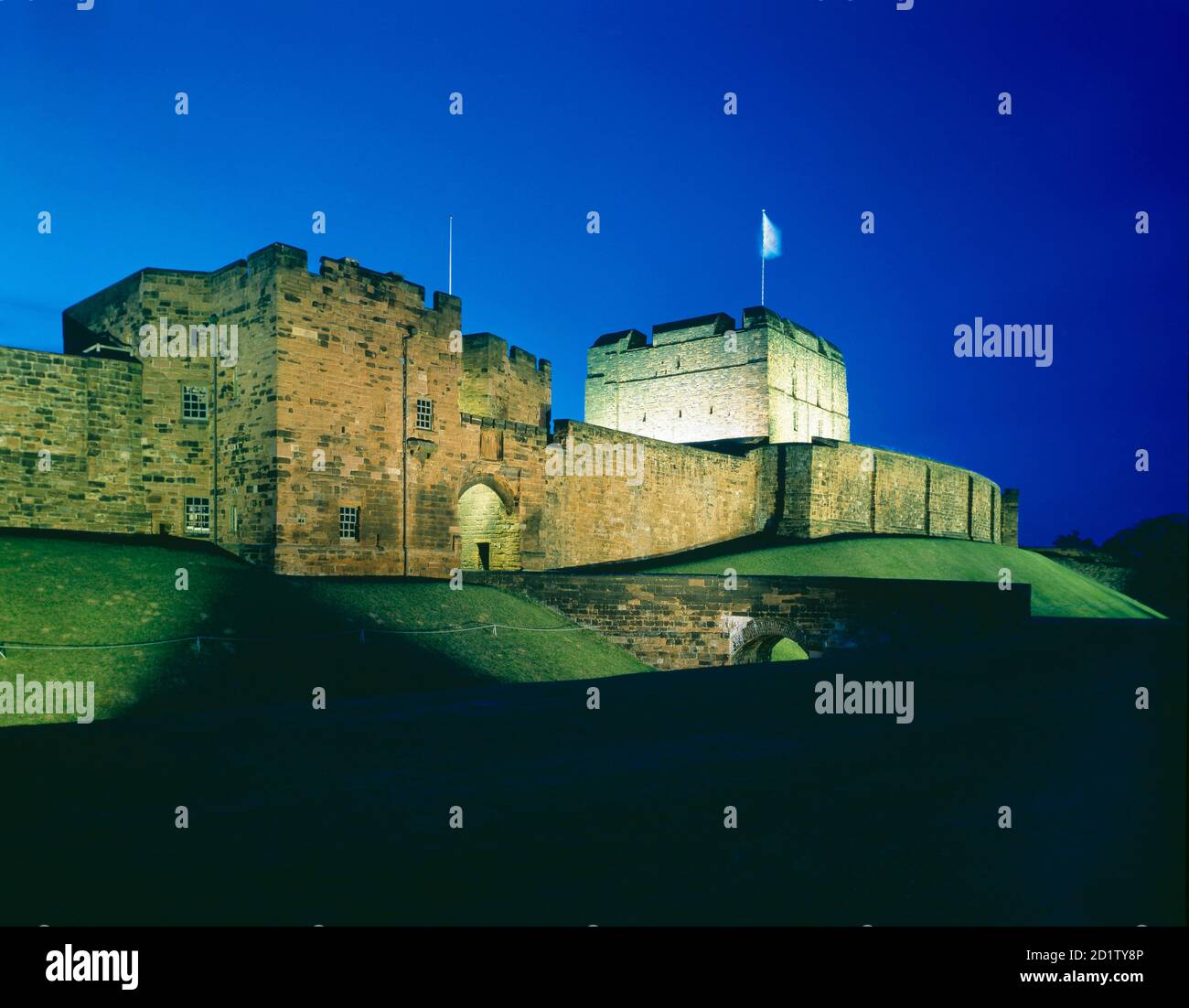 CARLISLE CASTLE, Cumbria. The Outer Gatehouse, Keep and Rampart Wall, floodlit at night. Stock Photo
