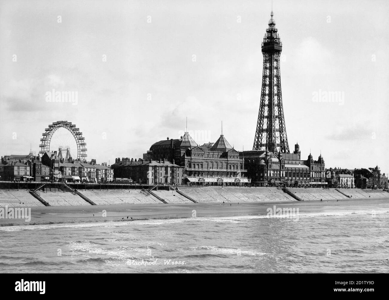 BLACKPOOL, Lancashire. A view looking south-east from the North Pier towards Blackpool Tower with the Big Wheel visible in the background. The tower was built in 1891-4 by Maxwell and Tuke and was based on the design of the Eiffel Tower in Paris. Photographed between 1894 and 1910 by W and Co. Stock Photo