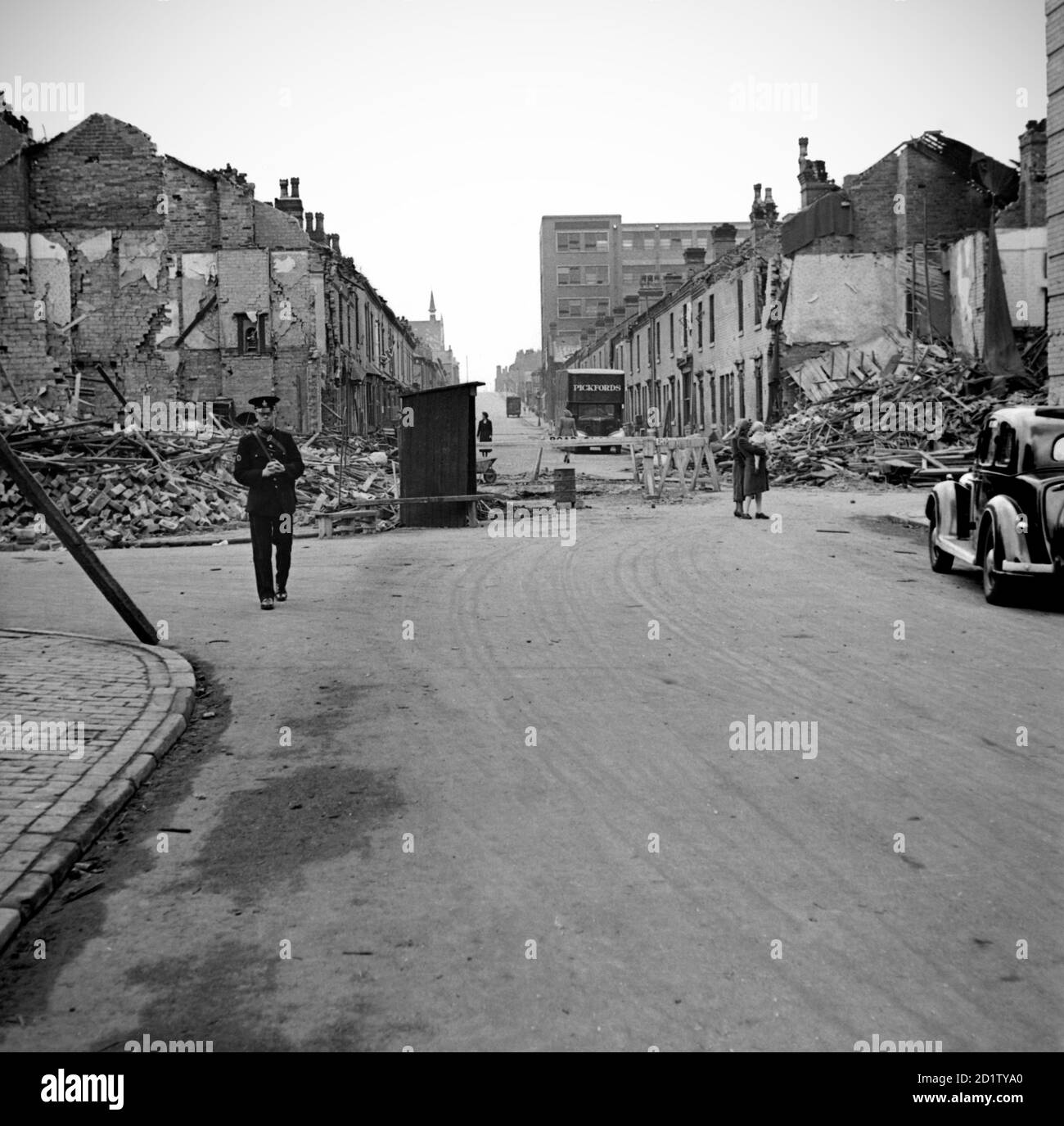 LONG ACRE, Nechells, Birmingham, West Midlands. Bomb damage photographed by James Nelson, 29th July 1942. The bomb crater in the road broke through to the river below. Stock Photo