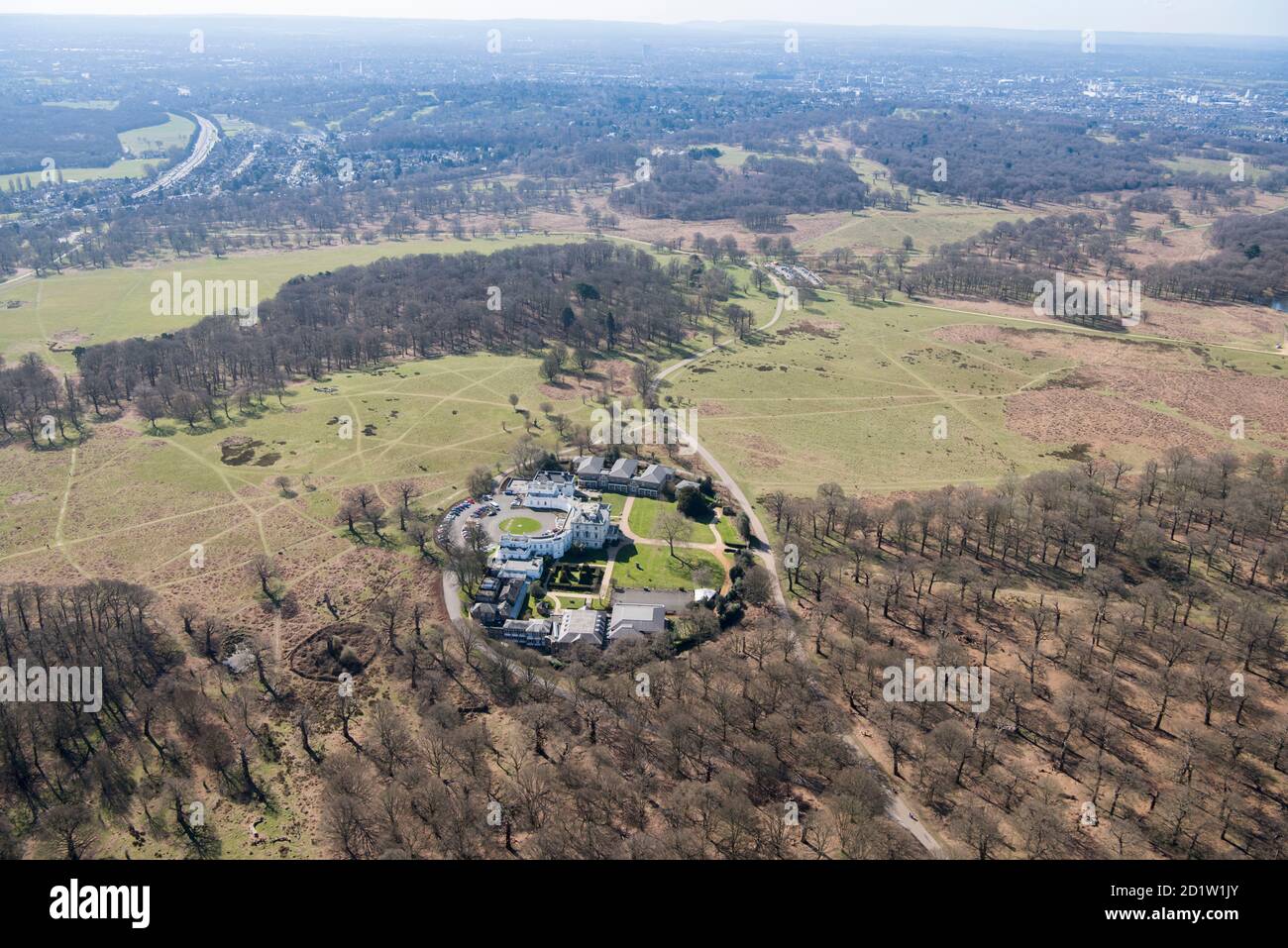 View over Richmond Park and White Lodge, a former hunting lodge and now the home of the Royal Ballet School, Richmond Park, London, UK. Aerial view. Stock Photo