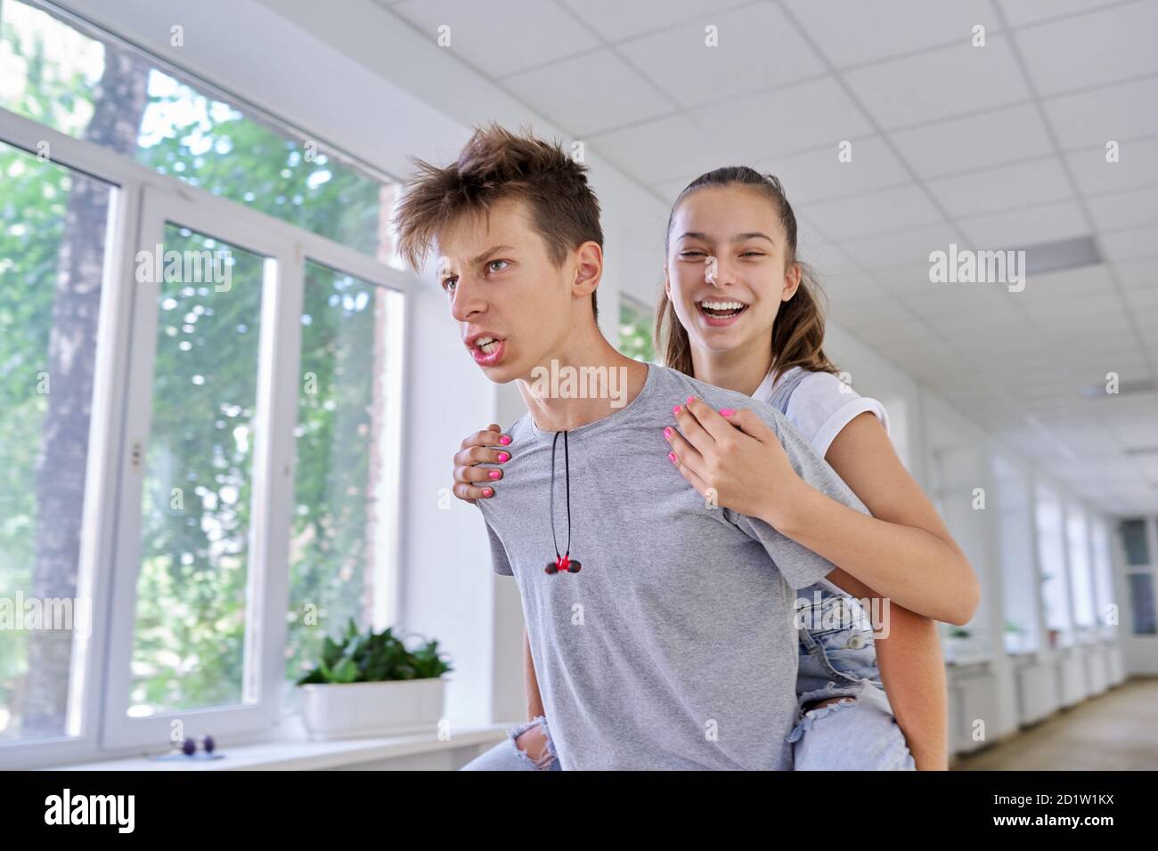 Teenagers boy and girl friends having fun at school Stock Photo ...