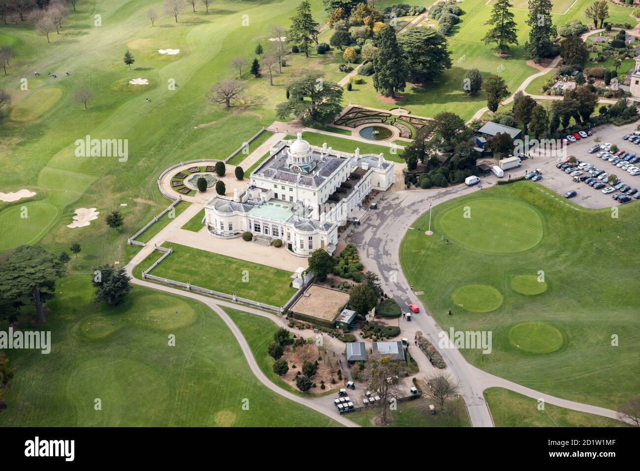 Stoke Park House and landscape park now incorporated into a golf course which forms part of a luxury hotel, spa and country club, Stoke Park, Buckinghamshire, UK. Aerial view. Stock Photo
