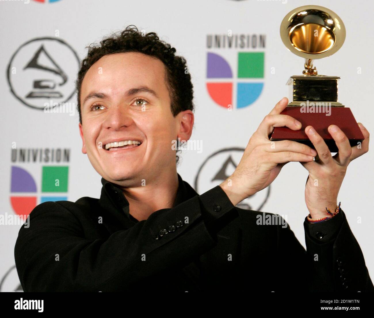 Juan Fernando Fonseca holds his award for Best Tropical Song with 