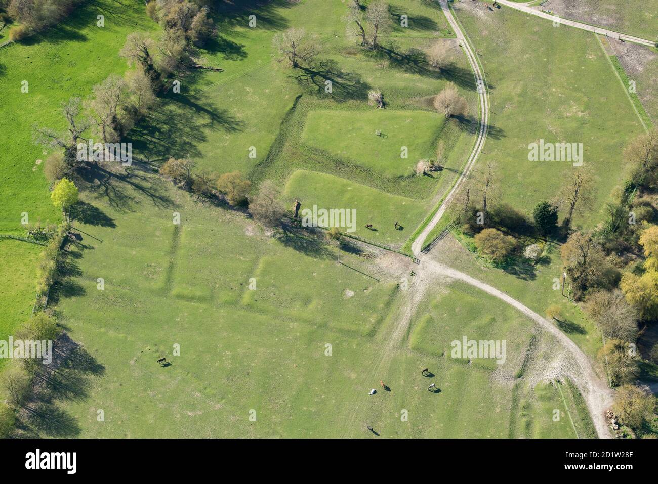 Medieval moat and settlement earthworks at Manor Farm, Great Kimble, Buckinghamshire, UK. Aerial view. Stock Photo