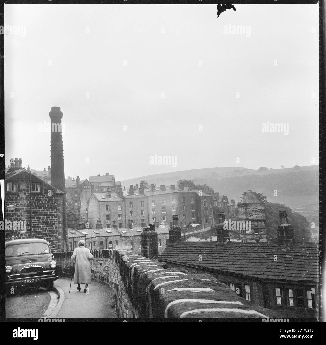 A view looking south from Keighley Road showing showing the gable wall of number 49 Keighley Road to the left and Unity Buildings in the distance, Hebden Bridge, West Yorkshire, UK. Stock Photo