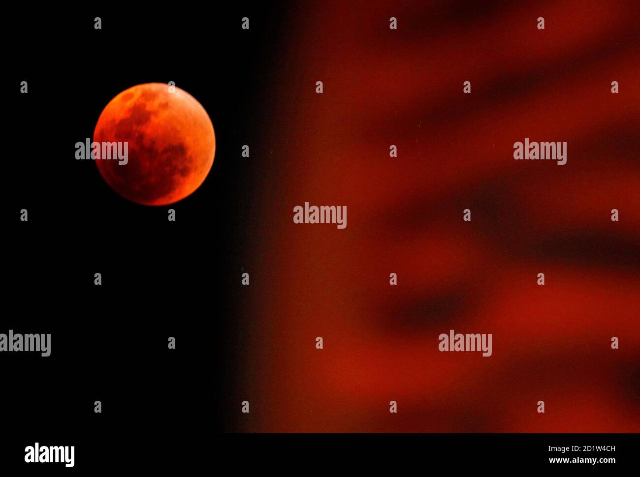 The Moon Is Visible During A Total Lunar Eclipse Next To A Flag Outside The Sydney Opera House August 28 07 A Total Lunar Eclipse Is Caused When The Moon Passes Completely