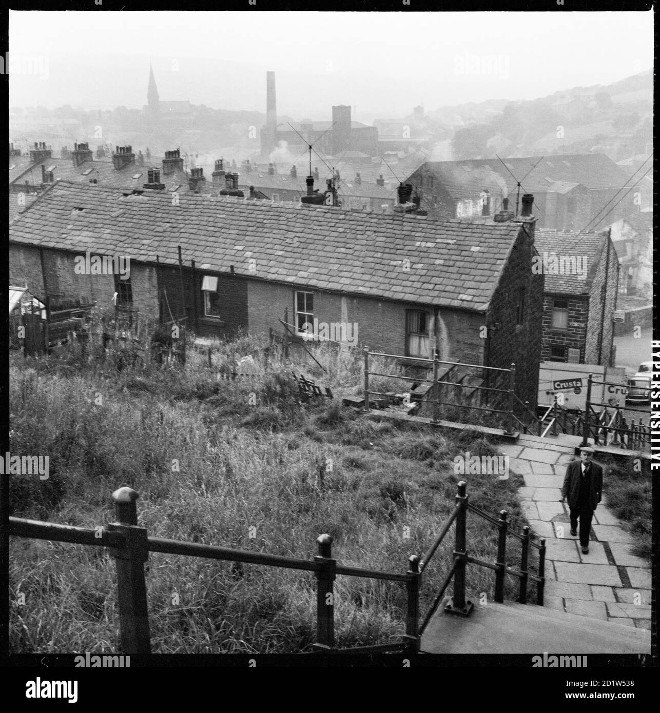 A view across Bacup from the summit of the steps linking Allan Street and Rochdale Road showing the rear of houses in Hemp Street, Rossendale, Lancashire, UK. Stock Photo