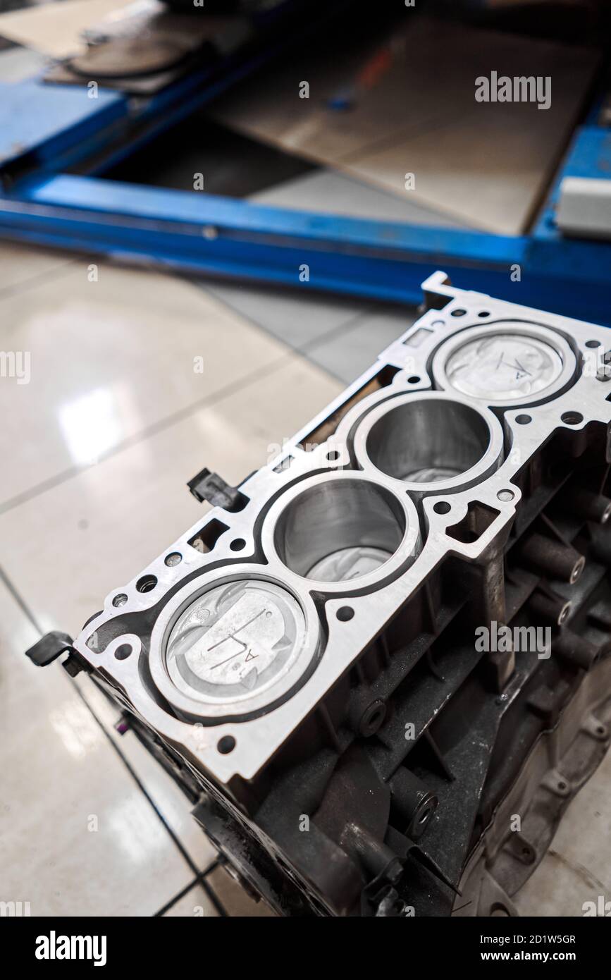 New pistons and cylinder head of engine block vehicle. Motor capital