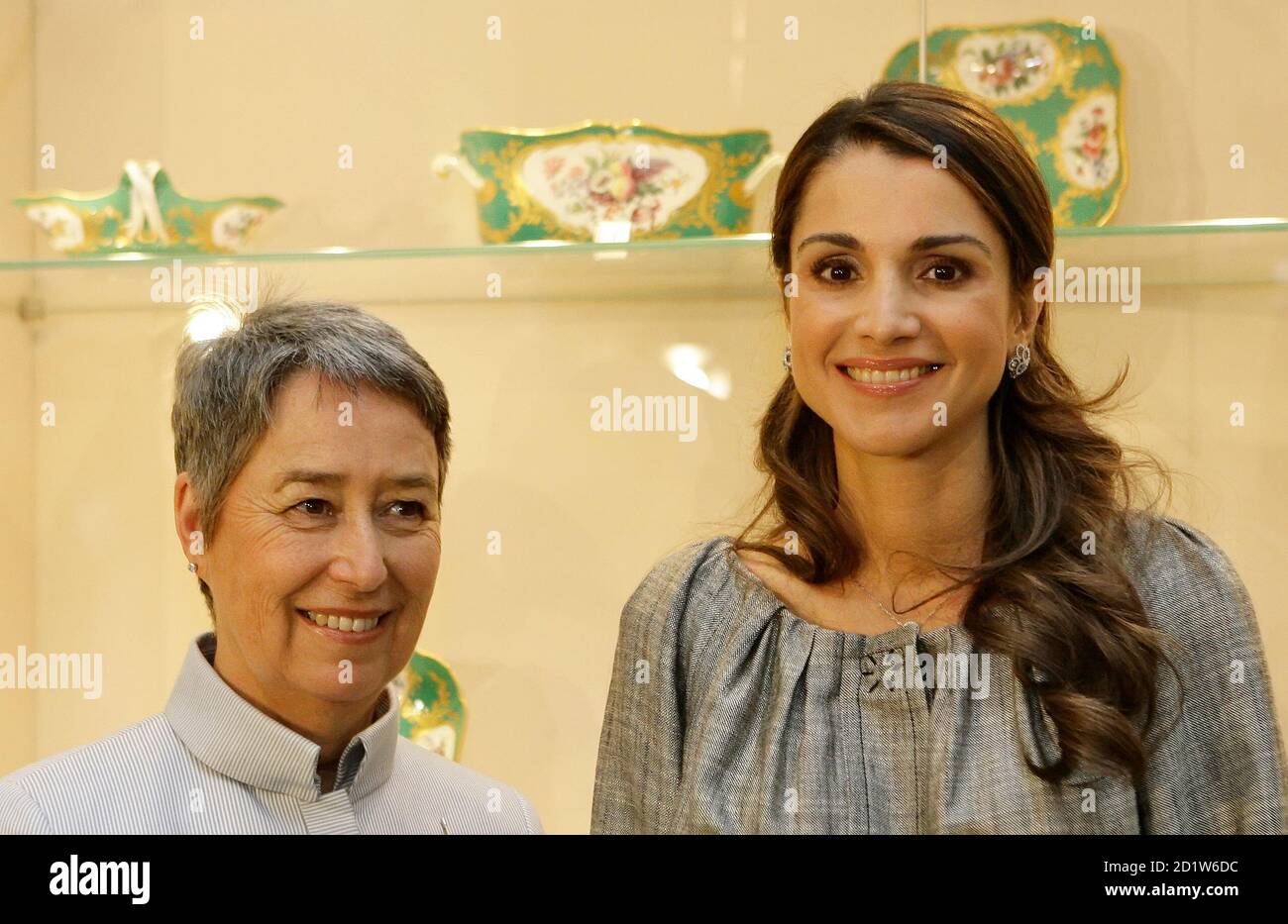 Austria's First Lady Margit Fischer and Queen Rania of Jordan (R) pose for photographers during a visit of the Imperial Silver Collection (Silberkammer) in Vienna's Hofburg palace April 9, 2008. REUTERS/Herbert Neubauer (AUSTRIA) Stock Photo