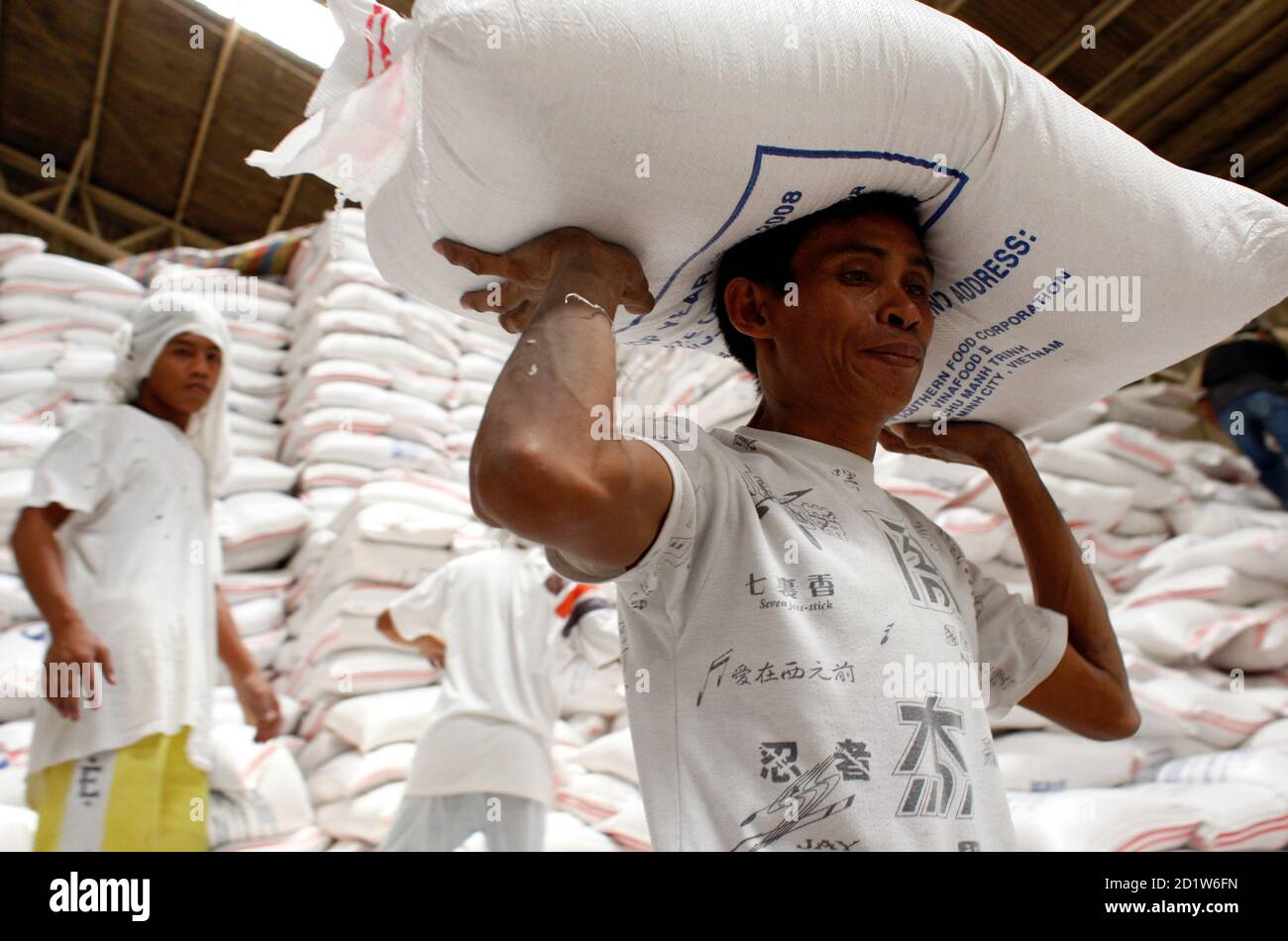 Man Carrying Sack Rice On High Resolution Stock Photography and Images