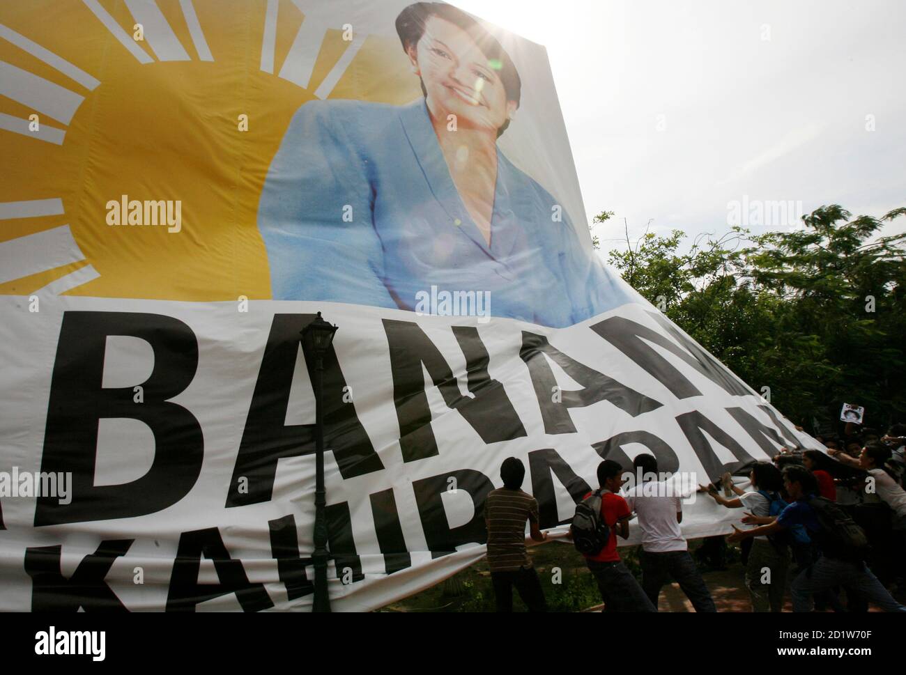 Students Try To Tear Down A Tarpaulin Poster Of President Gloria Macapagal Arroyo During A Protest In Manila June 12 08 The Students Were Protesting On Independence Day In What They Said