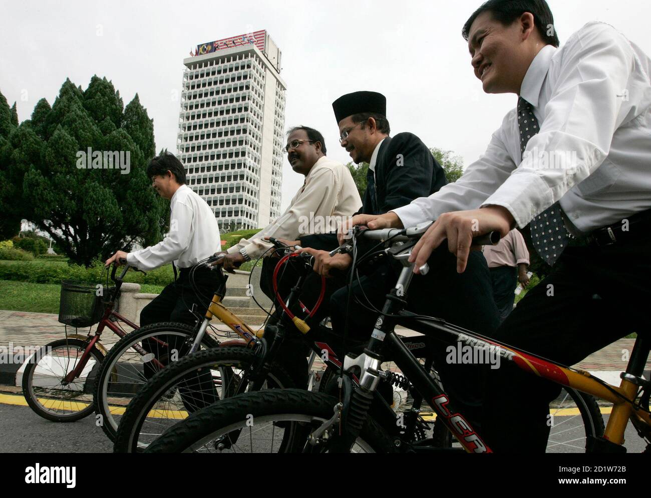 Malaysia S Members Of Parliament From The Opposition Parties Cycle To Parliament House To Show Their Protest Against The Petrol Hike In Kuala Lumpur June 23 2008 Pictured Are L To R Tian