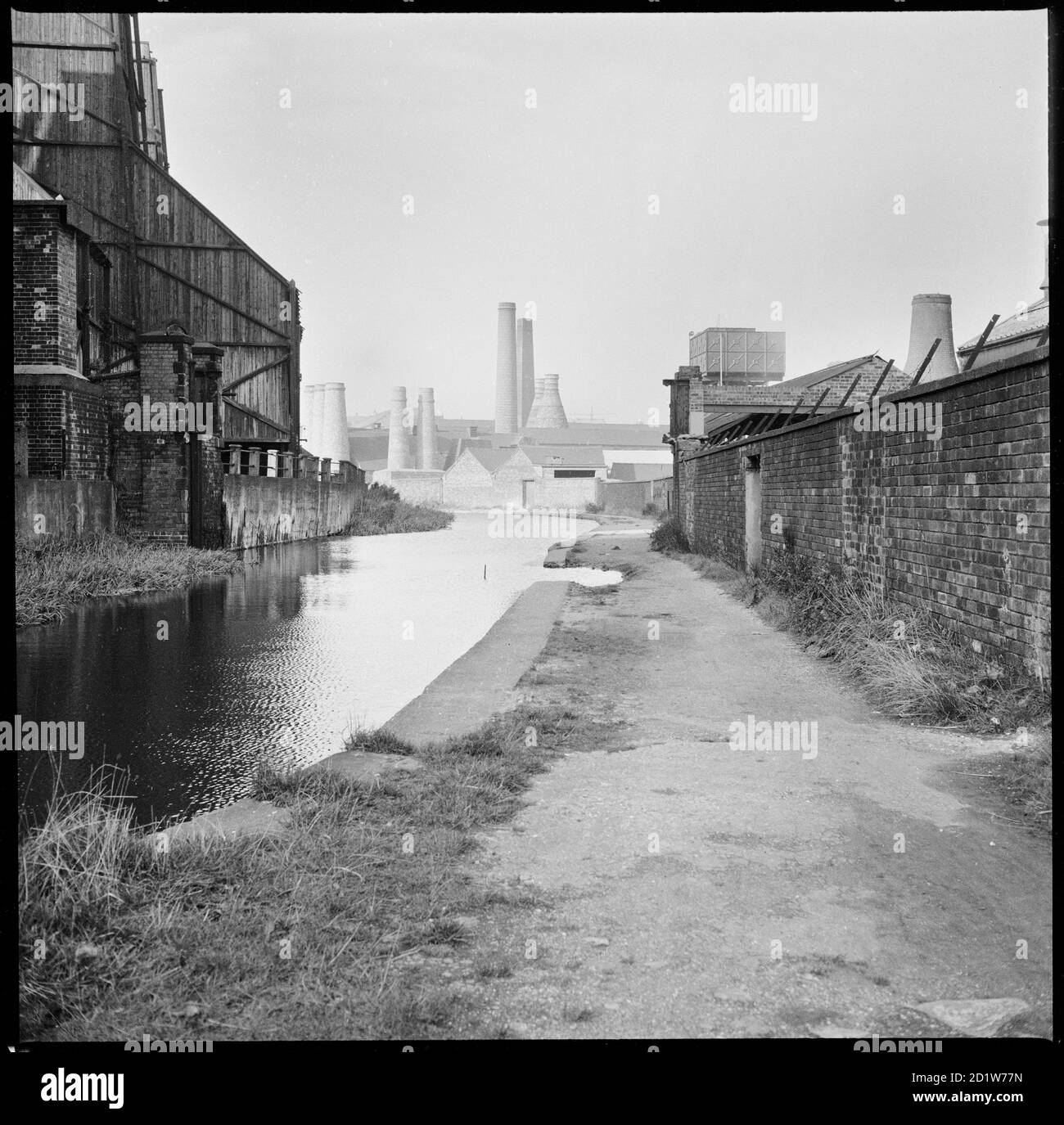 A view looking north along the Caldon Canal from a point opposite the Electricity Works with Trent Works and Westwood Mills in the background, Joiner's Square, Hanley, Stoke-on-Trent, Staffordshire, UK. Stock Photo