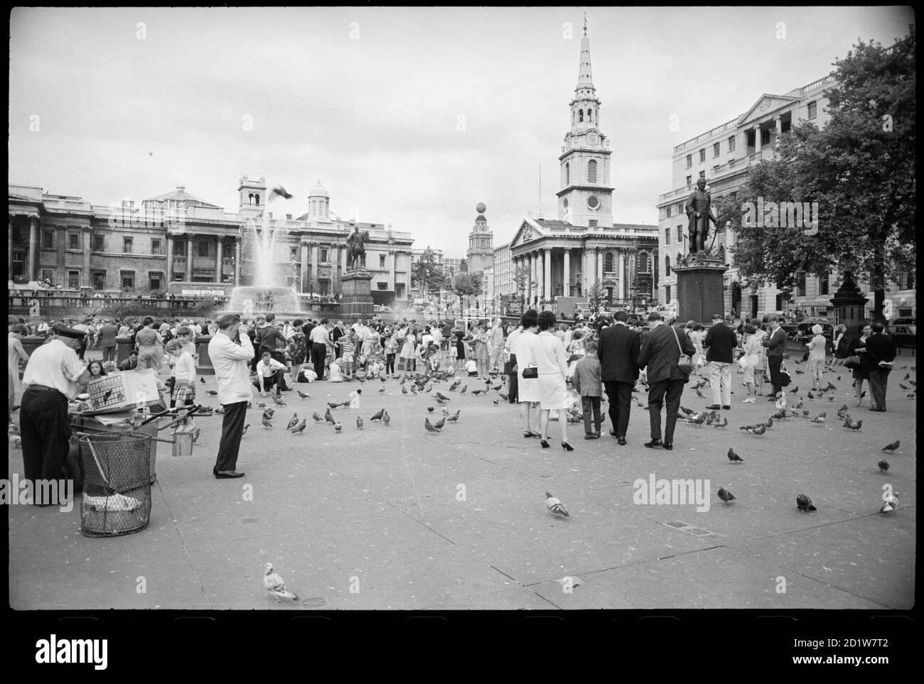 Trafalgar Square, St James, Westminster, City of Westminster, Greater London UK with National Gallery, St Martin in the Fields and street vendors. Stock Photo