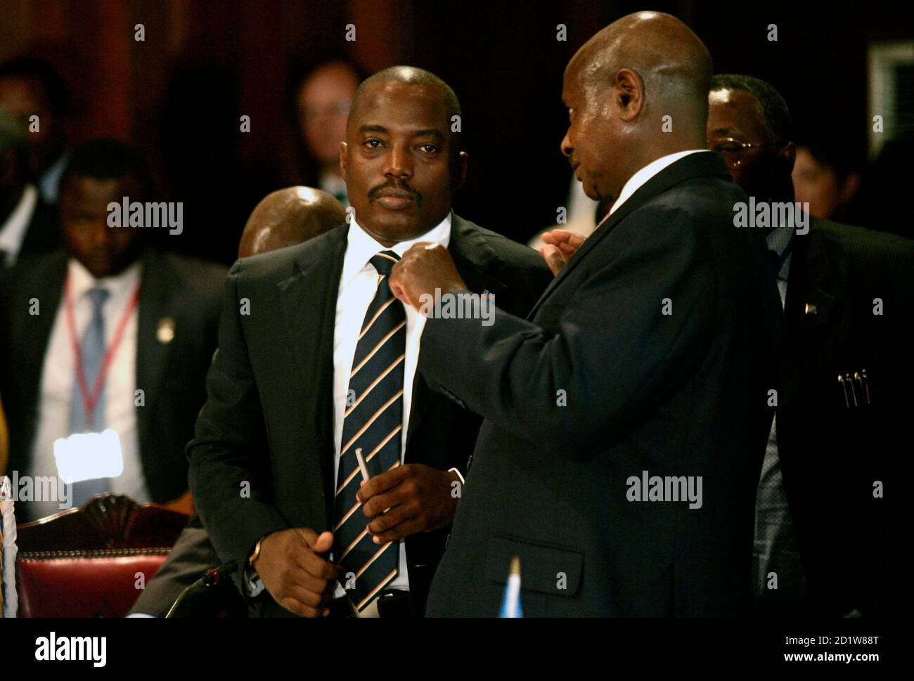 Democratic Republic of Congo's President Joseph Kabila listens to his Ugandan counterpart Yoweri Museveni after the opening session of the summit on the ongoing war crisis in eastern Congo in Kenya's capital Nairobi, November 7, 2008.  Congolese Tutsi rebels and government troops fought near a refugee camp in east Congo on Friday, forcing thousands of civilians to flee in panic. REUTERS/Thomas Mukoya (KENYA) Stock Photo