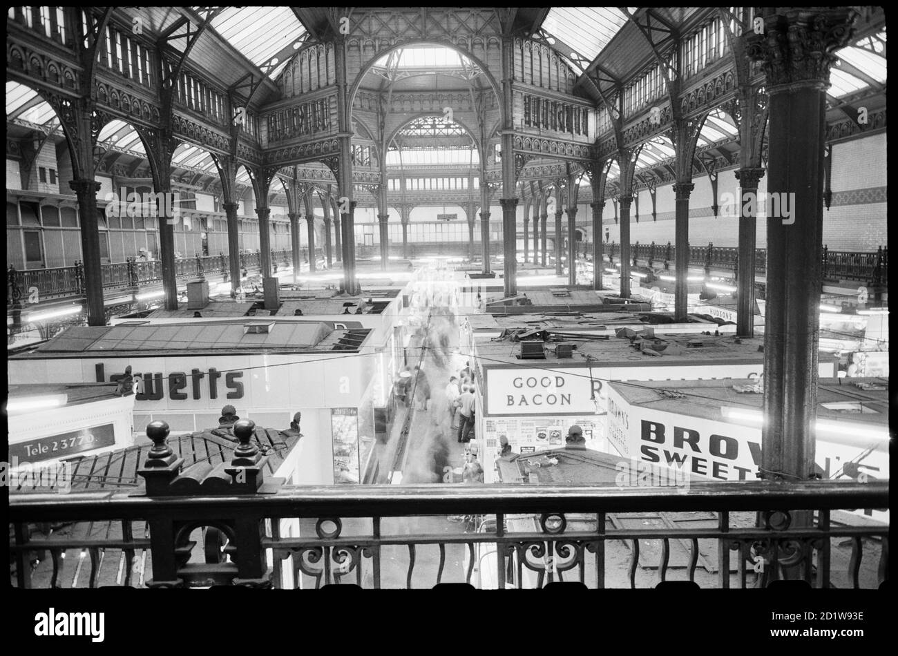 Interior view of City Markets, seen from a balcony on a short side of the hall and looking across the centre of the hall, showing rows of stalls below and the cast iron structure that supports the glazed clearestory and central octagon. Stock Photo