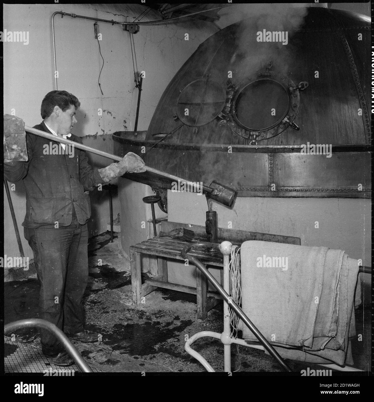 McMullen's Brewery, Hartham Lane, Hertford, Hertfordshire. A man taking
