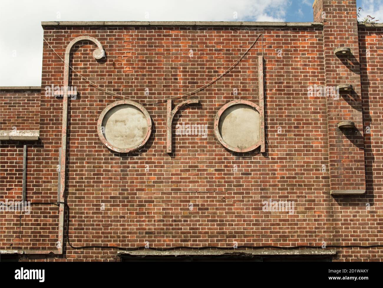 King's Lynn, Norfolk. Detail of the 'Ford' sign on the east side of the former car showroom. Stock Photo