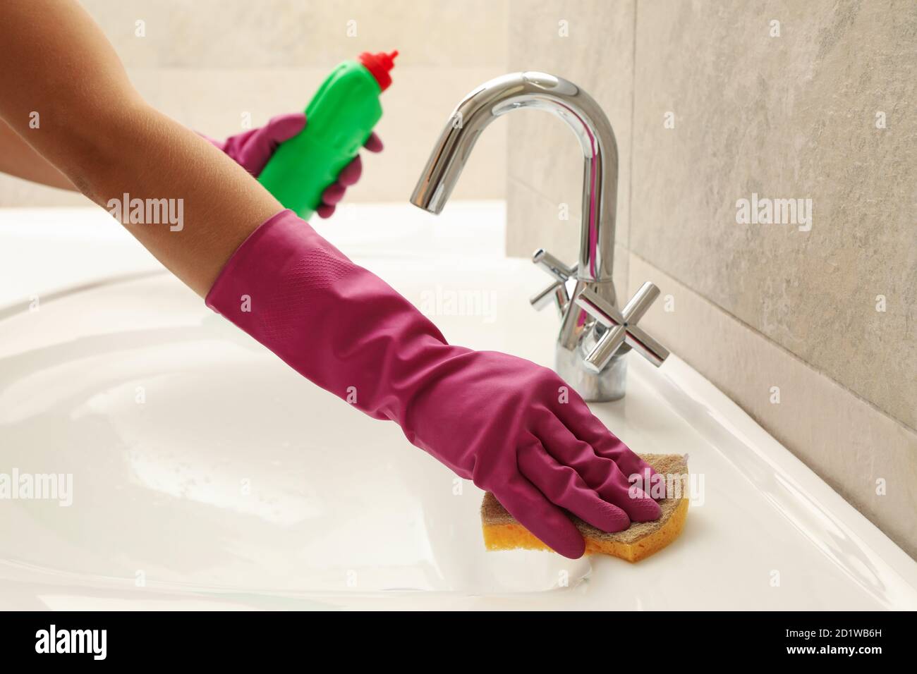 Woman in rubber pink glove cleaning sink Stock Photo Alamy