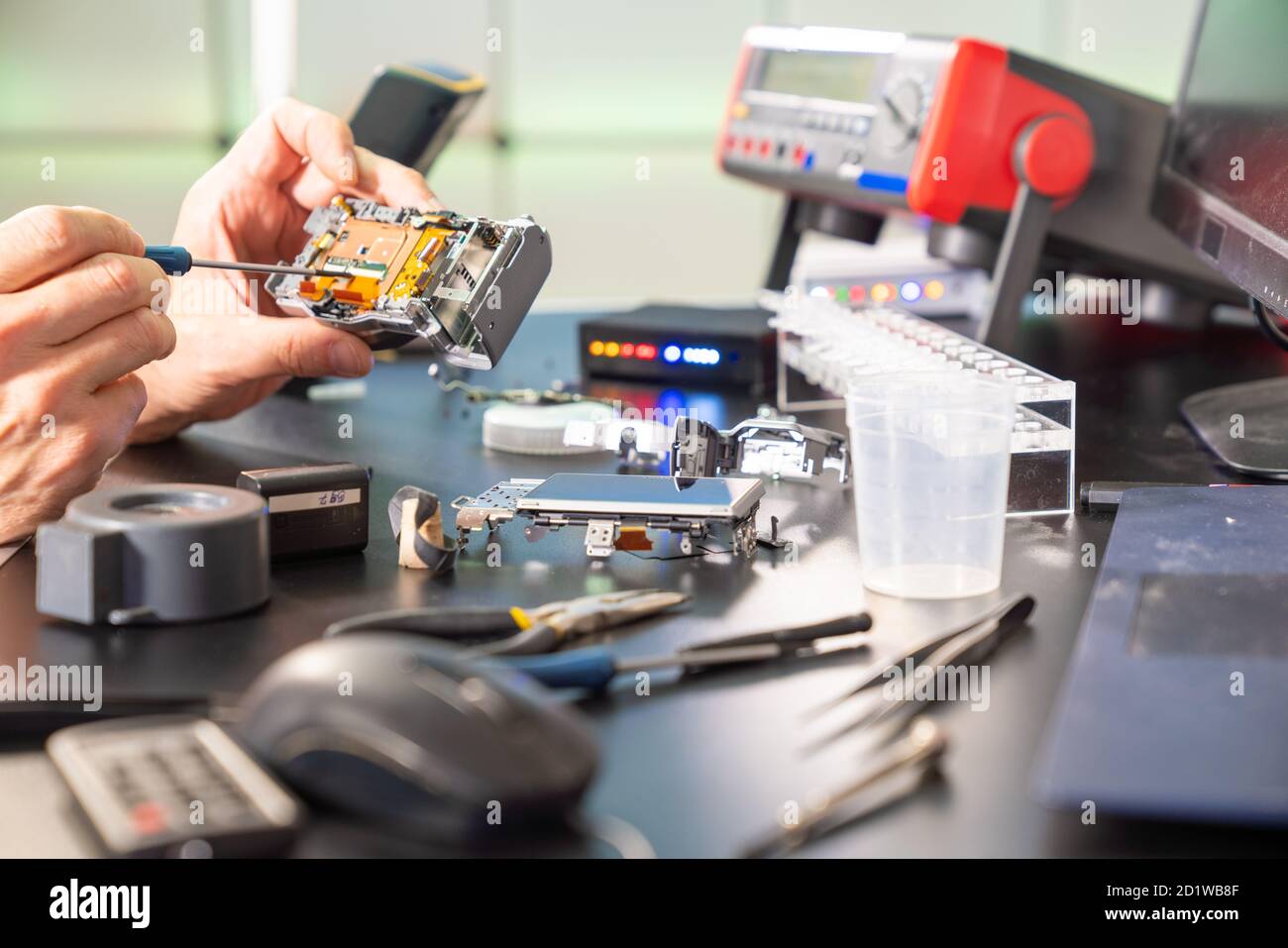 Support Repair Photo Technology repair of photo camera in services support Stock Photo - Alamy