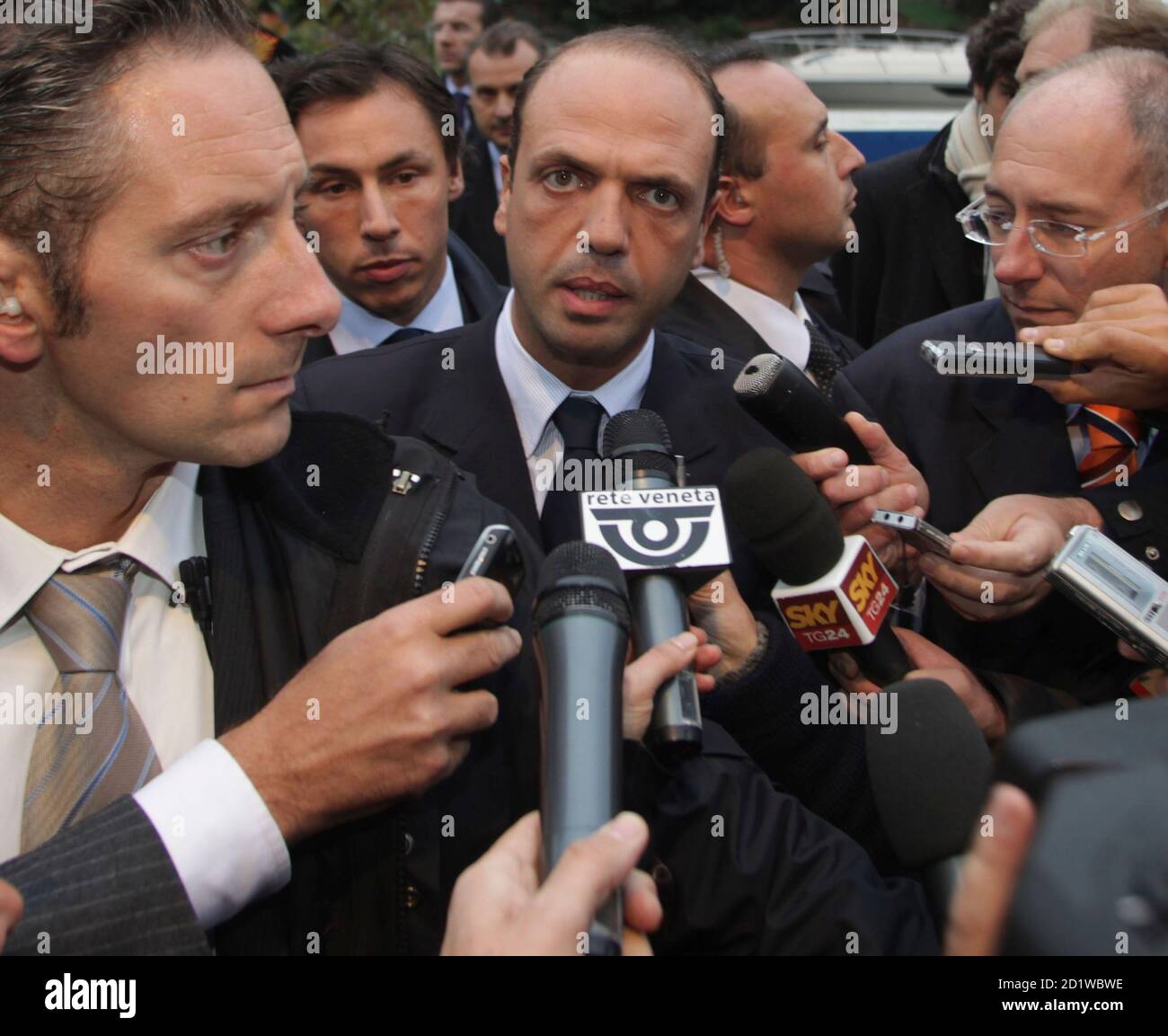 Italy's Justice Minister Angelino Alfano (C) speaks to reporters outside the annual meeting of notaries in Venice October 21, 2009. REUTERS/Manuel Silvestri       (ITALY POLITICS) Stock Photo