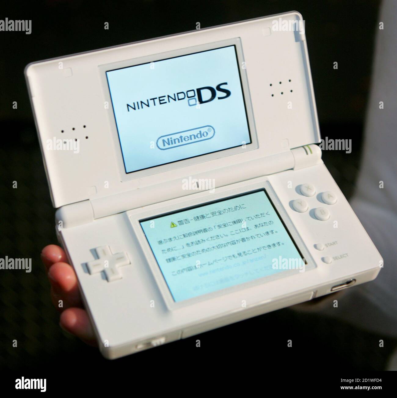 Nintendo Co. unveils its new dual screen handled video game console  "Nintendo DS Lite" in Tokyo February 15, 2006. The 218-gram (7.69-ounce)  game console will start sales on March 2, for the
