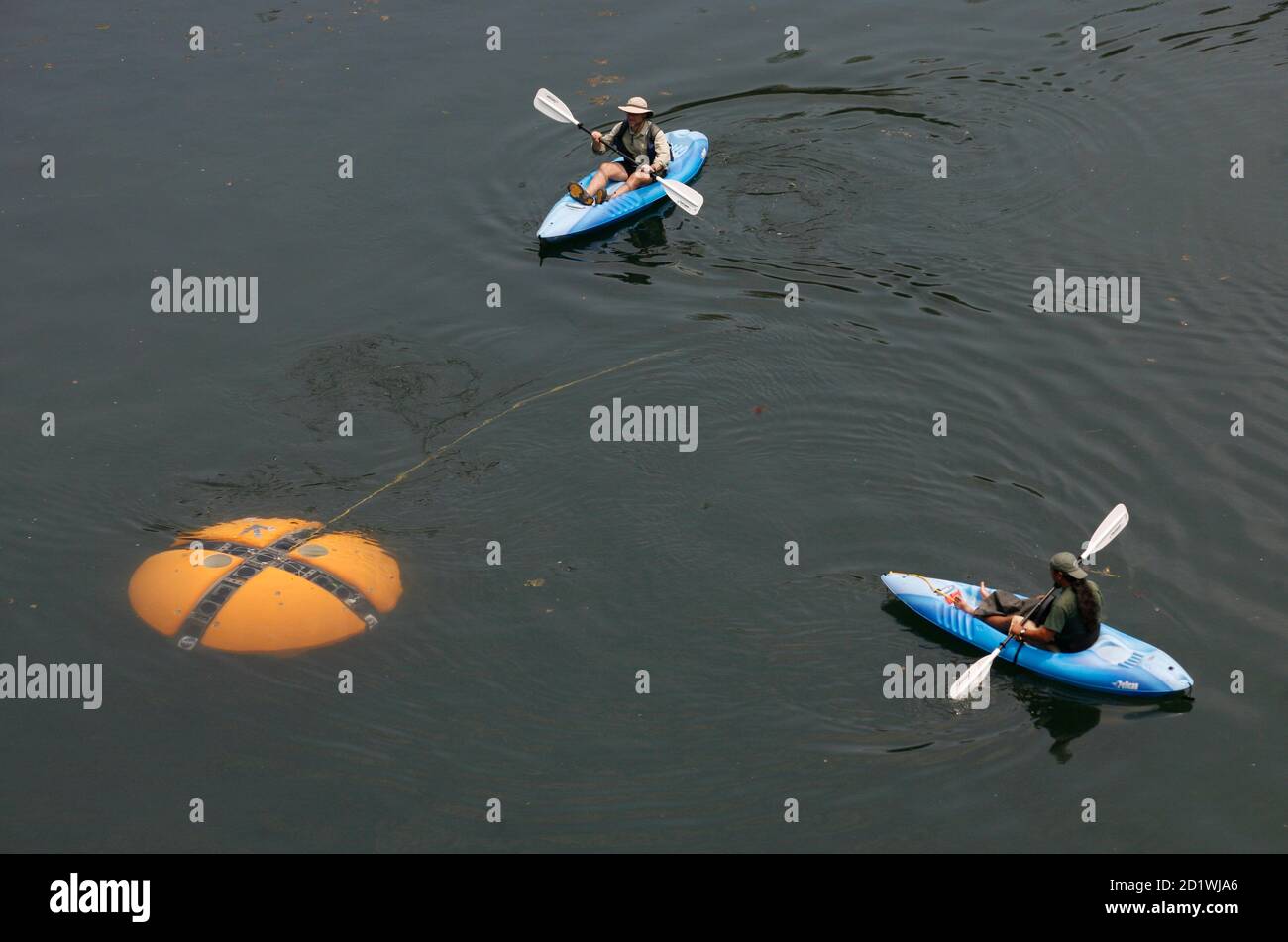 Scientists move their kayaks next to the self-automated "DEPTHX" (Deep  Phreatic Thermal Explorer) robot at El Zacaton sinkhole, or cenote, in the  northwestern Mexican state of Tamaulipas May 17, 2007. NASA is