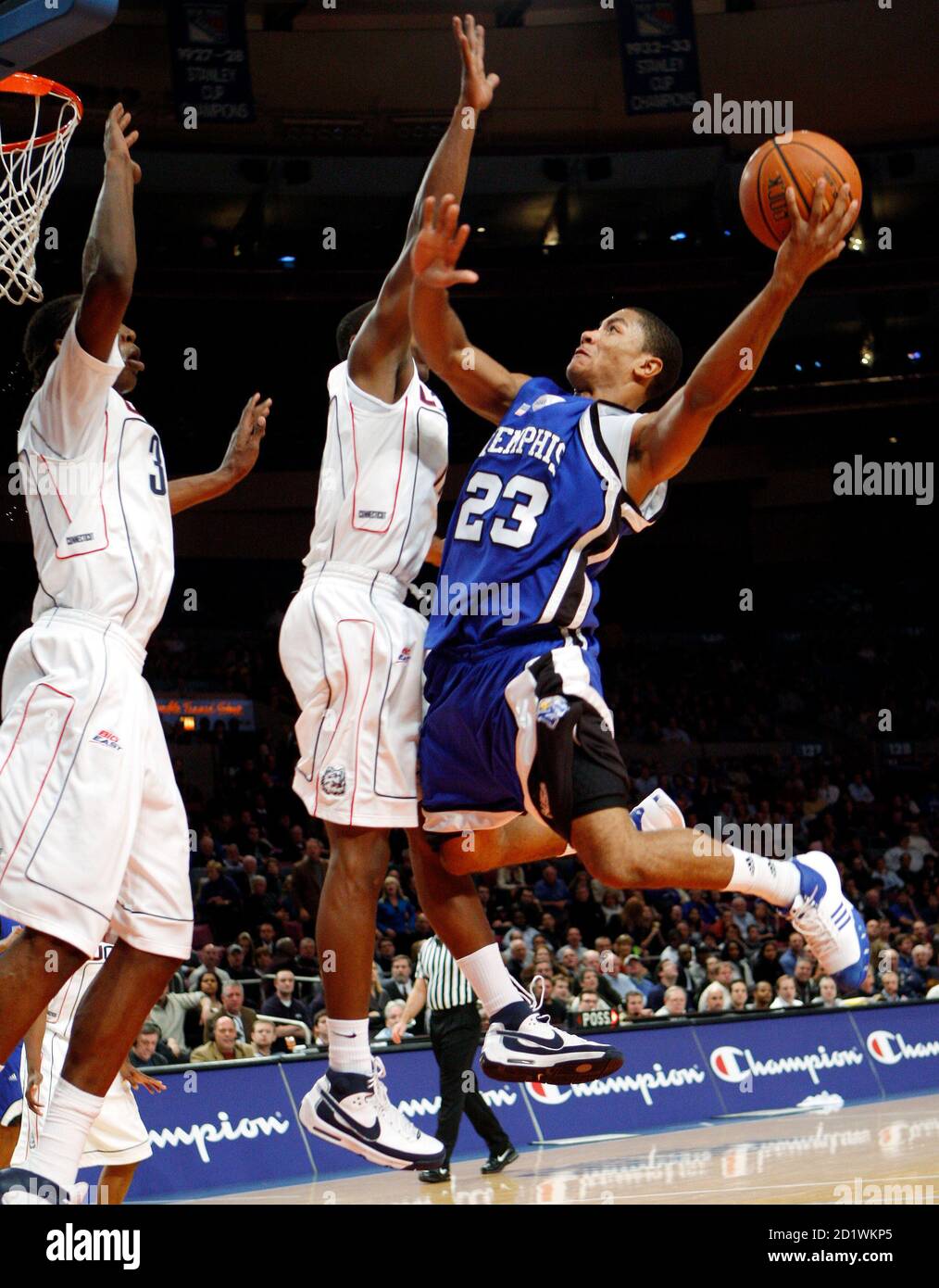 University of Memphis guard Derrick Rose (R), drives to the basket against  University of Connnecticut's Jerome Dyson (C) during the first half of the  championship game of the 2007 2K Sports College