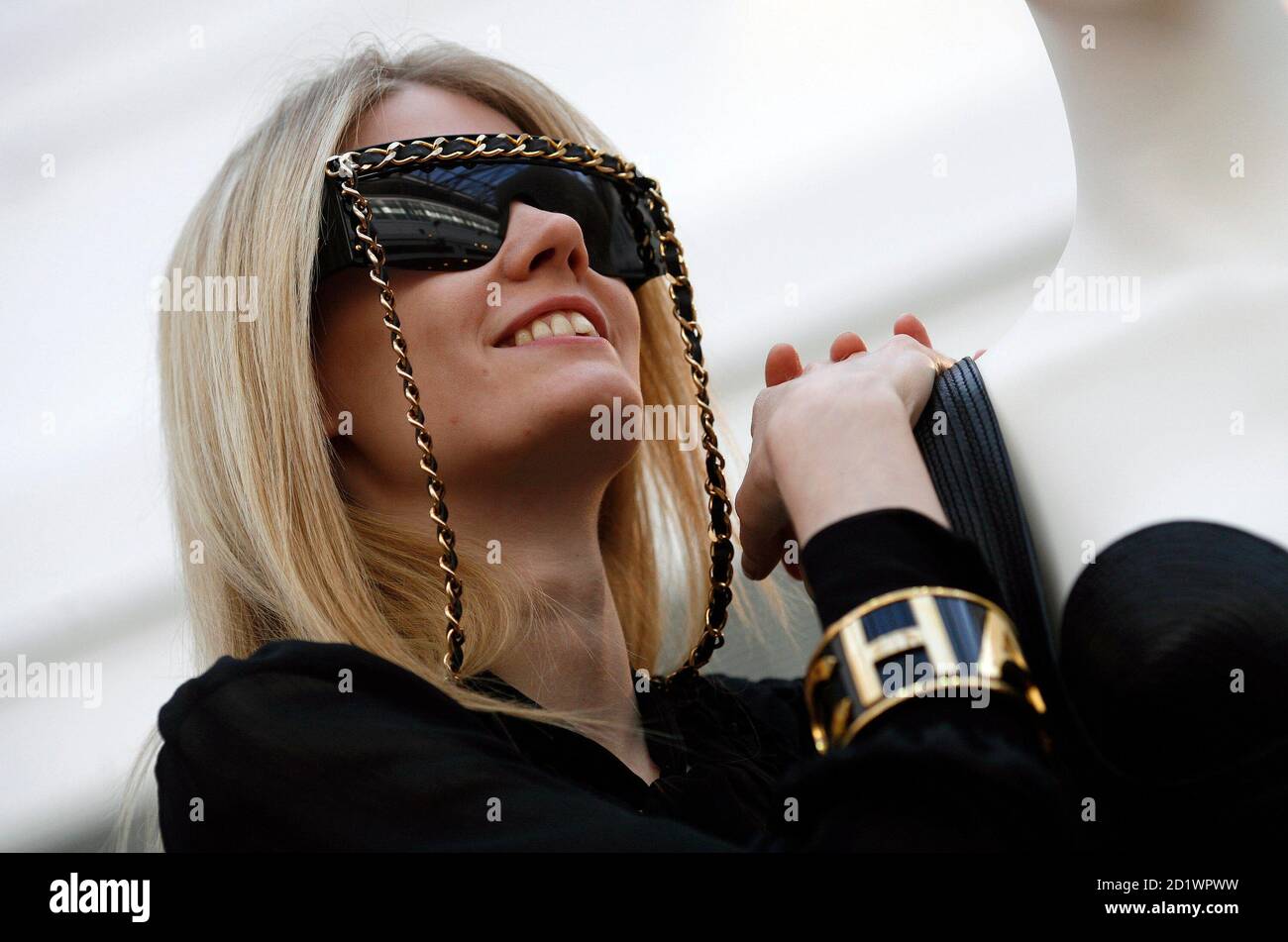A model poses with Chanel's outsize sunglasses during a photocall at  Christie's auction house in London October 28, 2008. The item is expected  to fetch up to six hundred pounds at the