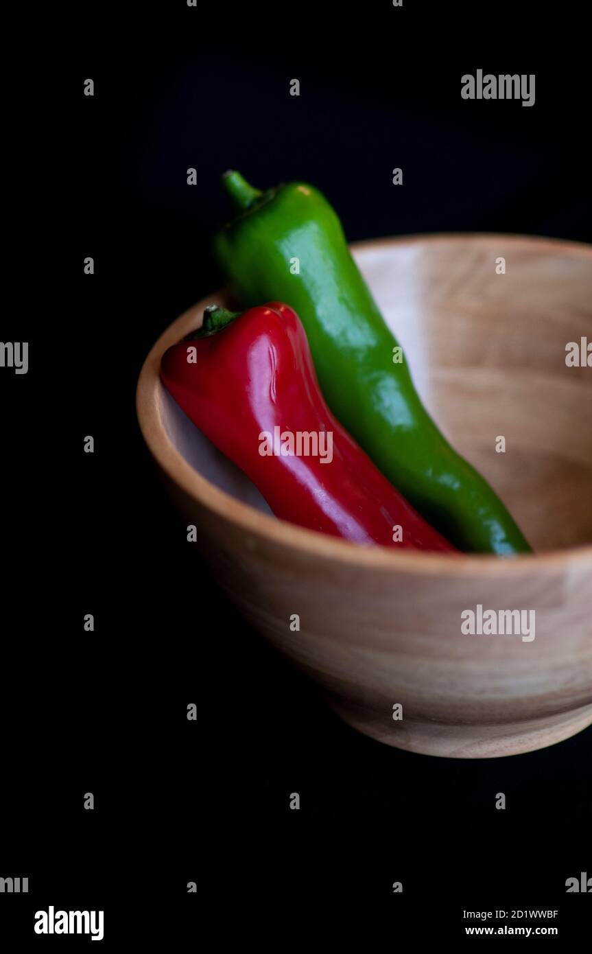 Red and green chilli on a black background. High quality photo Stock Photo