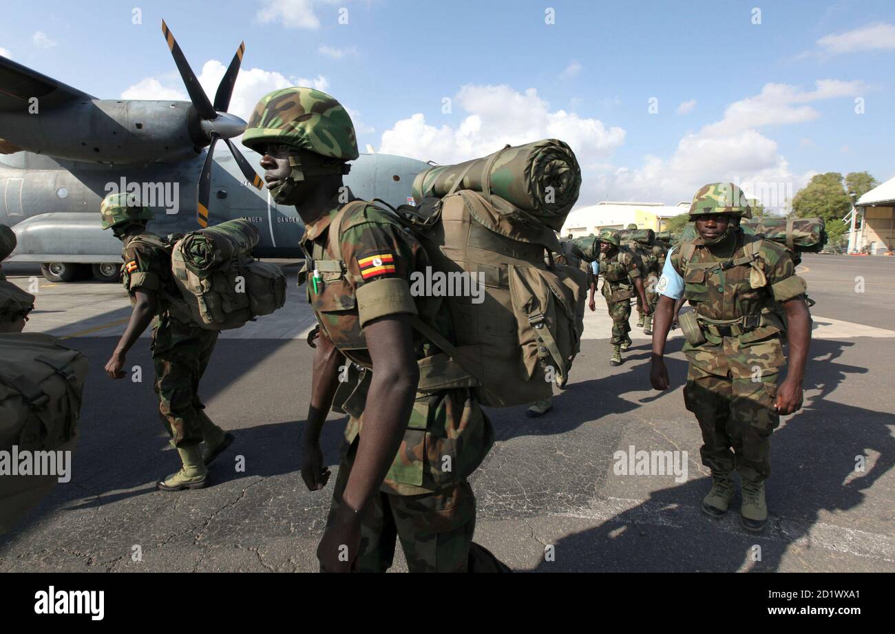 Members of the Eastern Africa Standby Brigade from Uganda queue to board a French tactical aircraft C160 Transall at the French Air Base 188 in Djibouti, December 5, 2009. The EASB is holding the exercise involving 1,500 troops - from Kenya, Uganda, Rwanda, Ethiopia, Sudan, Burundi, Comoros, Seychelles and Somalia. The aim is to build a proper African peackeeping force which will be able to respond to wars/crises throughout the continent and has the backing of major Western powers as this is the first big exercise they are undertaking. REUTERS/Thomas Mukoya (DJIBOUTI CONFLICT POLITICS CRIME LA Stock Photo