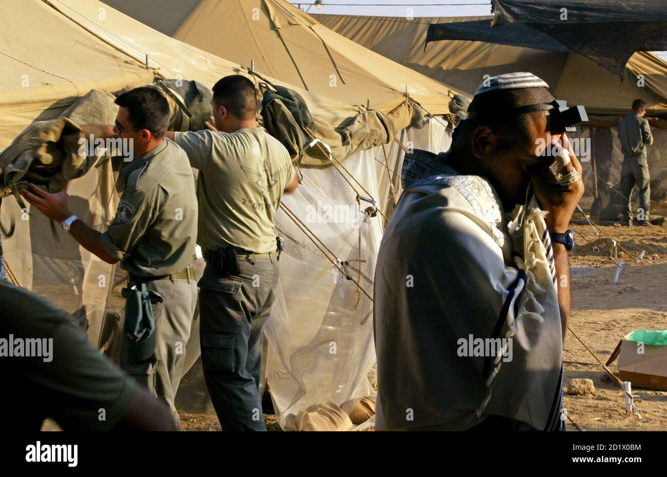 An Israeli border police officer prays 