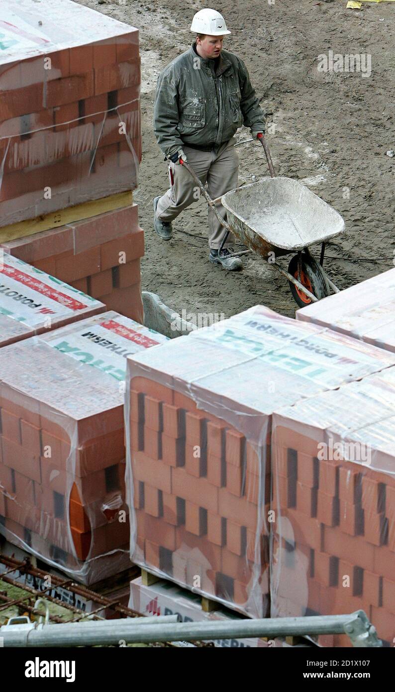 A worker pushes a wheelbarrow at a construction site in Brussels January 24, 2006. The European Union finance ministers meeting, chaired by Austria, sought a deal on Tuesday to prolong reduced sales tax rates in trades such as home repairs with negotiations made simpler by news that France was no longer likely to torpedo a deal. The Czechs, Poland, Hungary and Latvia said the Austrian plan would undermine the special status they enjoy under the terms of their entry into the EU club -- the right to reduce VAT on all kinds of building work and not just repairs to old buildings as is the case for Stock Photo