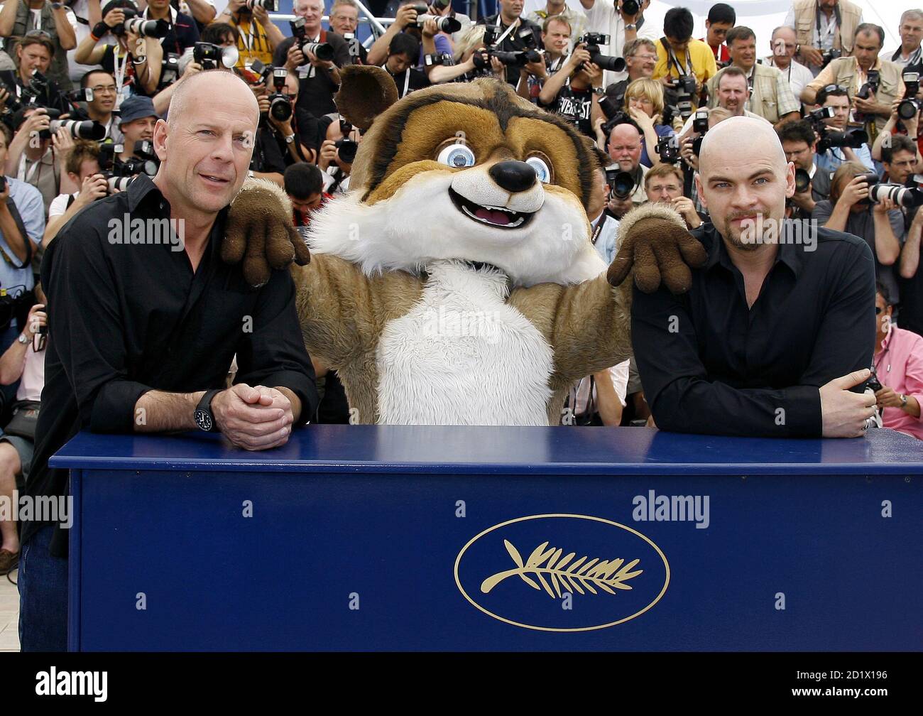 Cast members . actor Bruce Willis (L) and French actor Clovis Cornillac  attend a photocall for directors [Karey Kirkpatrick and Tim Johnson's] out  of competition animated film 'Over the Hedge' at the