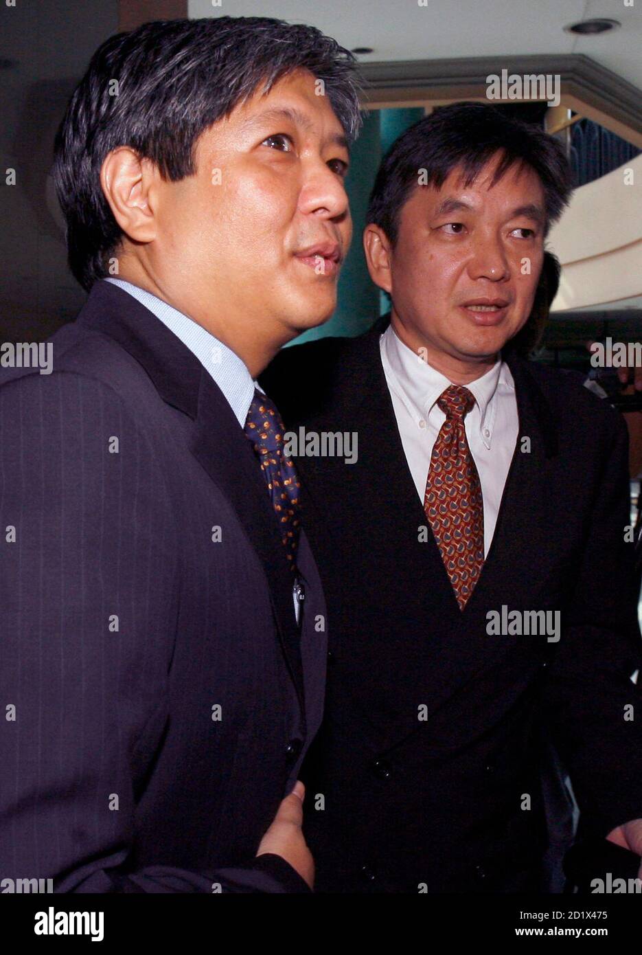 Ferdinand Bongbong Marcos Jr L A Philippine Congressman And Son Of Late Dictator Ferdinand Marcos Walks With His Lawyer Joseph Taddy Before The Start Of A Hearing At The Anti Graft Court In