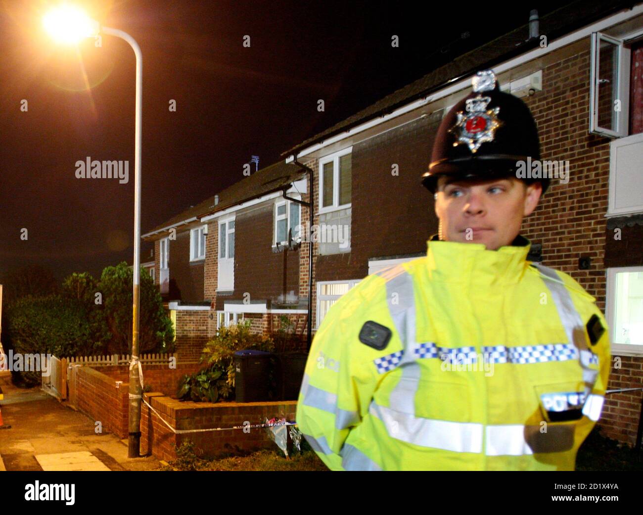 A police officer stands guard at a cordon outside a house in central Margate, southeast England, November 16, 2007.  A second body was found at the property today where extensive searches are under way as part of a nationwide investigation into unsolved cases of missing girls. Officers have been looking for remains of teenager Dinah McNicol, and have already found remains of missing 15-year-old Vicky Hamilton at the same Kent address.      REUTERS/Toby Melville      (BRITAIN) Stock Photo