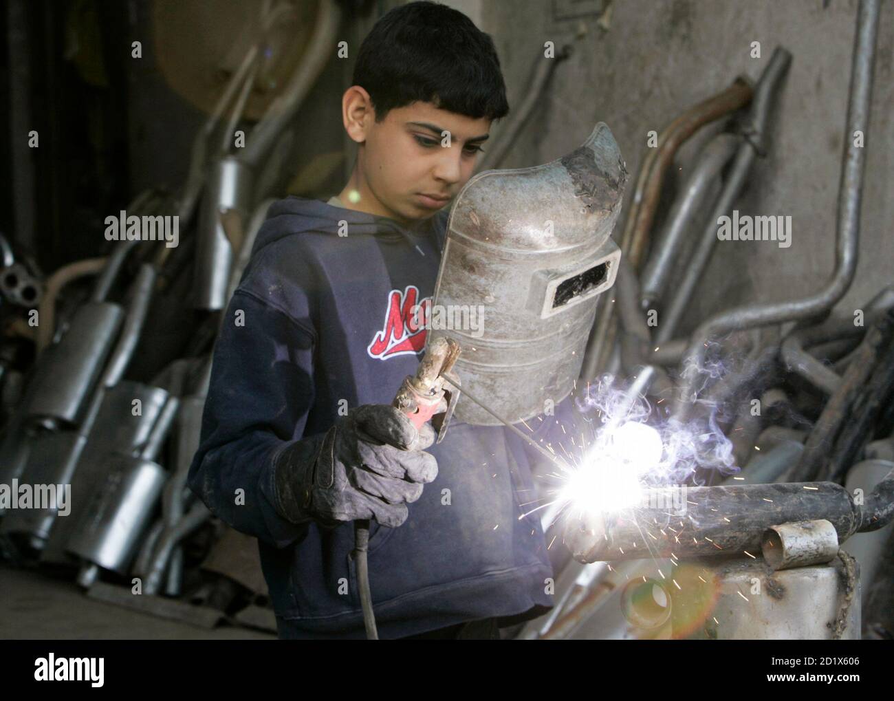 Abdullah Monther 13 Year Old Welds At A Shop Selling Vehicles Exhaust Pipes In Arbil About 350 Km 2 Miles North Of Baghdad March 1 08 Abdullah An Arabic Shi Ite Resident Dropped Out From