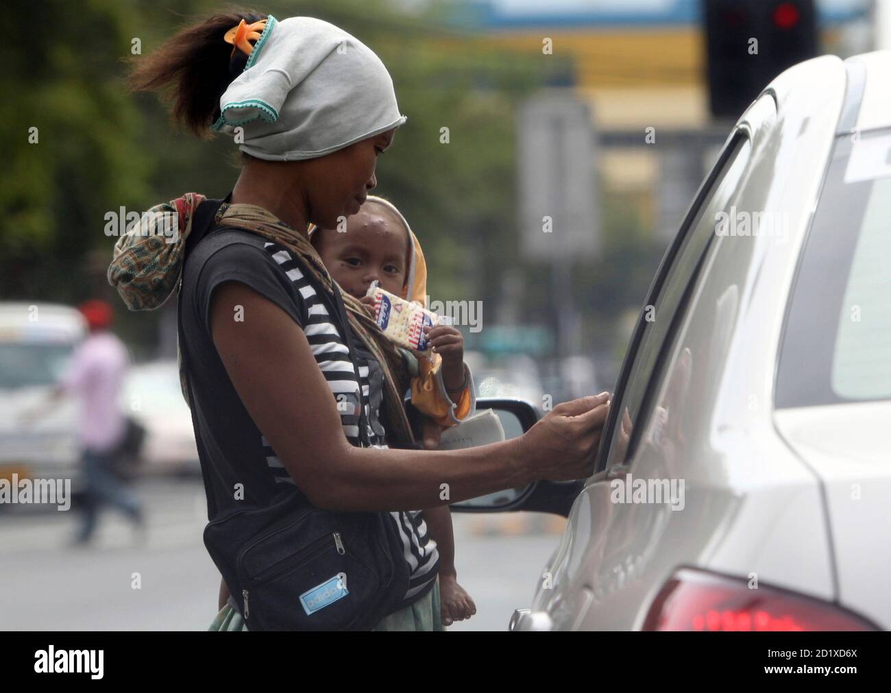 pic Noynoy Aquino Presidential Car https www alamy com a beggar carry a baby boy while asking for alms along a main street in manila may 18 2010 poverty alleviation and creation of more jobs are among the challenges facing senator and presidential candidate benigno noynoy aquino jr who is on course to become the next philippine president after last week national and local elections reutersromeo ranoco philippines tags politics society image379823890 html
