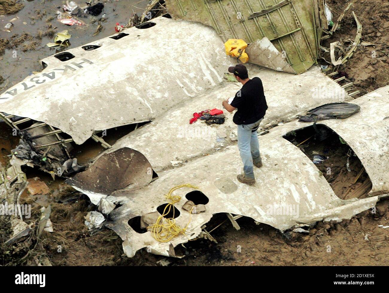 Rescue workers search the wreckage of the West Caribbean Airways MD-82  aircraft in Machiques, about 100 miles (161 km) southwest of Maracaibo,  Venezuela, August 17, 2005. Investigators sifted for bodies and clues