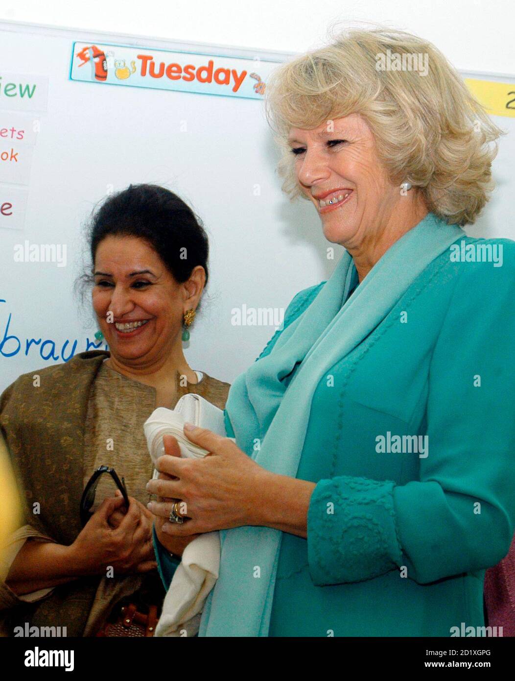 duchess-of-cornwall-camilla-r-smiles-as-she-tours-the-center-for-child-evaluation-and-teaching-in-kuwait-city-february-20-2007-prince-charles-and-the-duchess-are-on-a-four-day-official-visit-reutersyasser-al-zayyatpool-kuwait-2D1XGPG.jpg