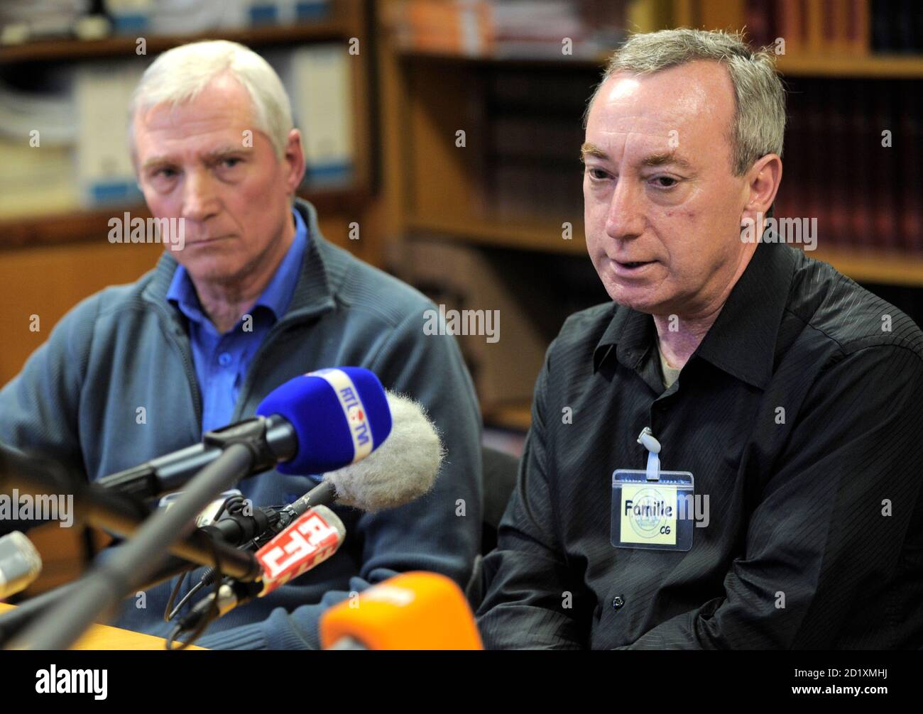 Jean-Pierre Lavillle, father of Isabelle and Jean-Pierre Saison (R), father  of Celine, both victims of French self-confessed serial killer Michel  Fourniret, talk to reporters at Charleville-Mezieres courthouse, France  March 28, 2008. The